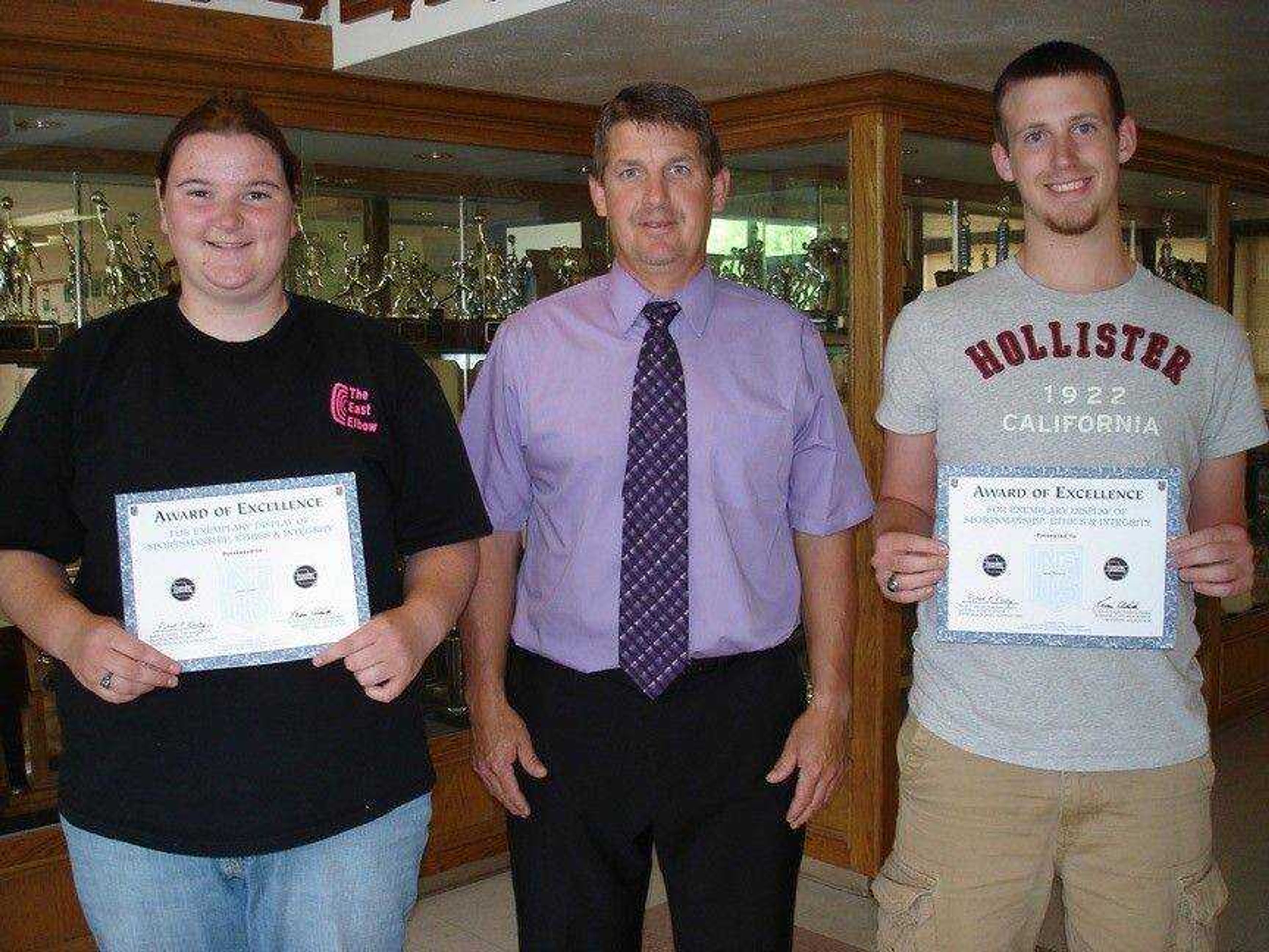 Casey Brewer (left), daughter of Tim and Julie Brewer and Jason Thieret, son of David and Melissa Thieret are shown with PHS Athletic Director Jeff Steffens.