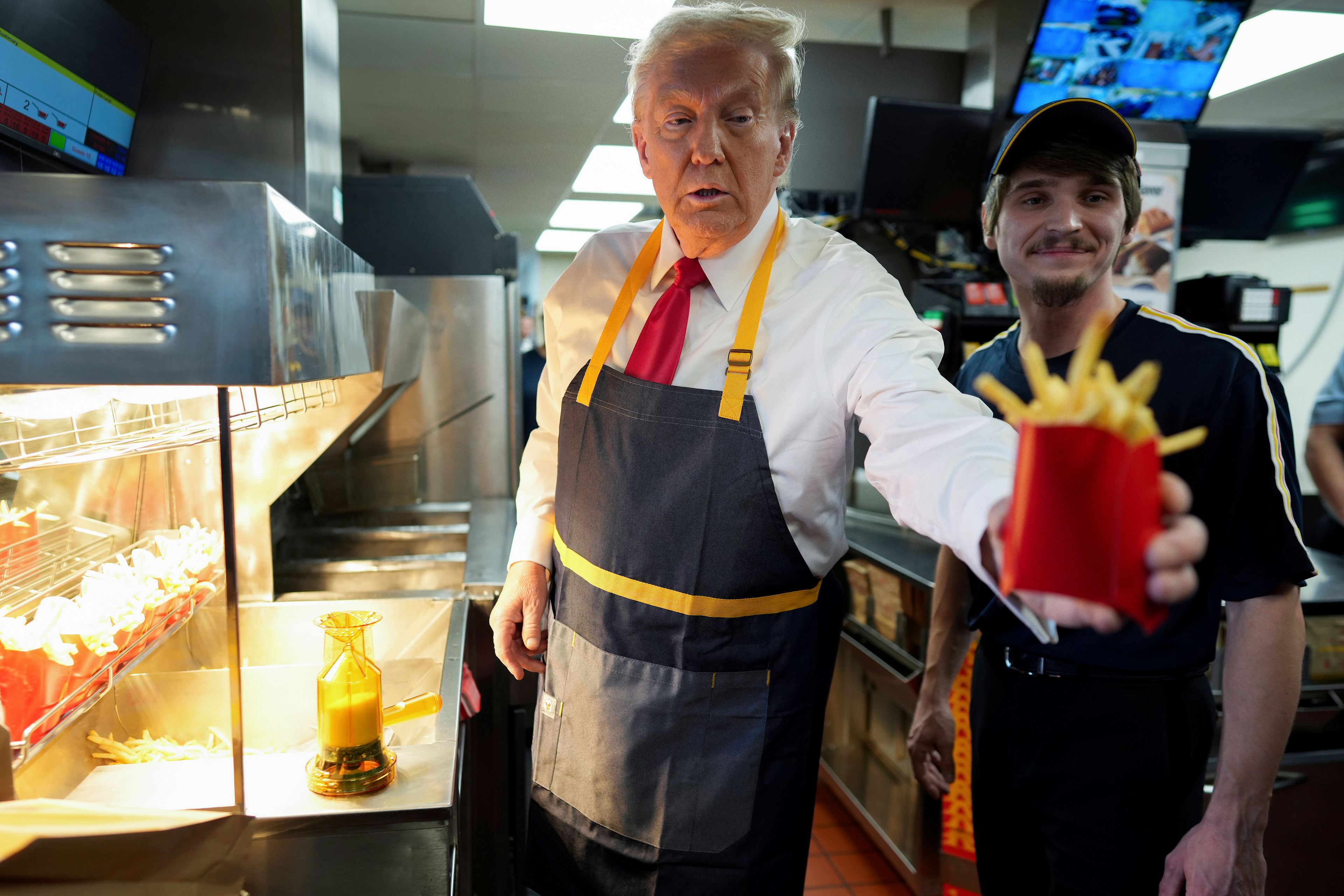 Trump works the fry station and holds a drive-thru news conference at a Pennsylvania McDonald's