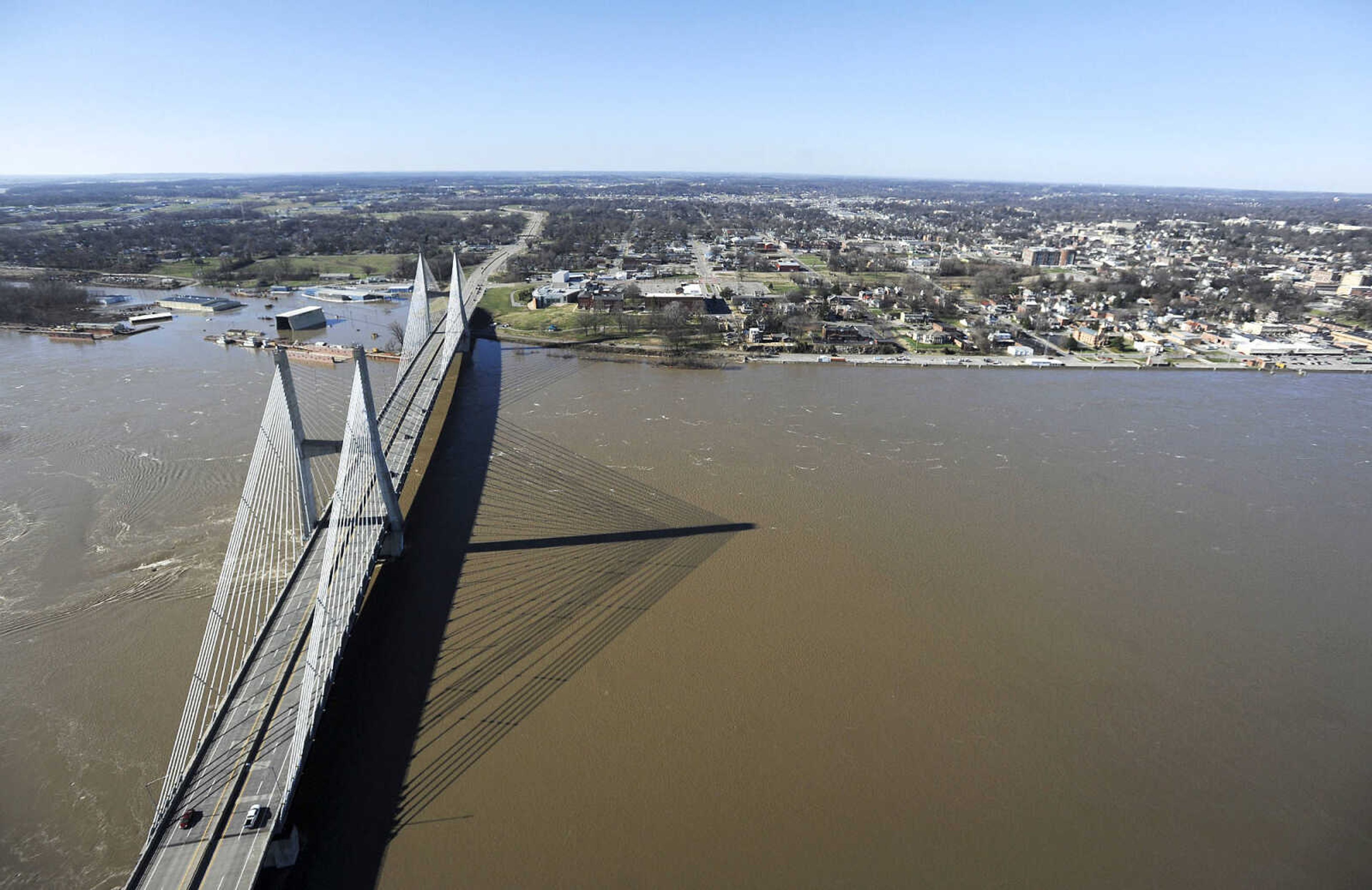 LAURA SIMON ~ lsimon@semissourian.com

The swollen Mississippi River is seen flowing under the Bill Emerson Memorial Bridge in Cape Girardeau, Saturday, Jan. 2, 2016.