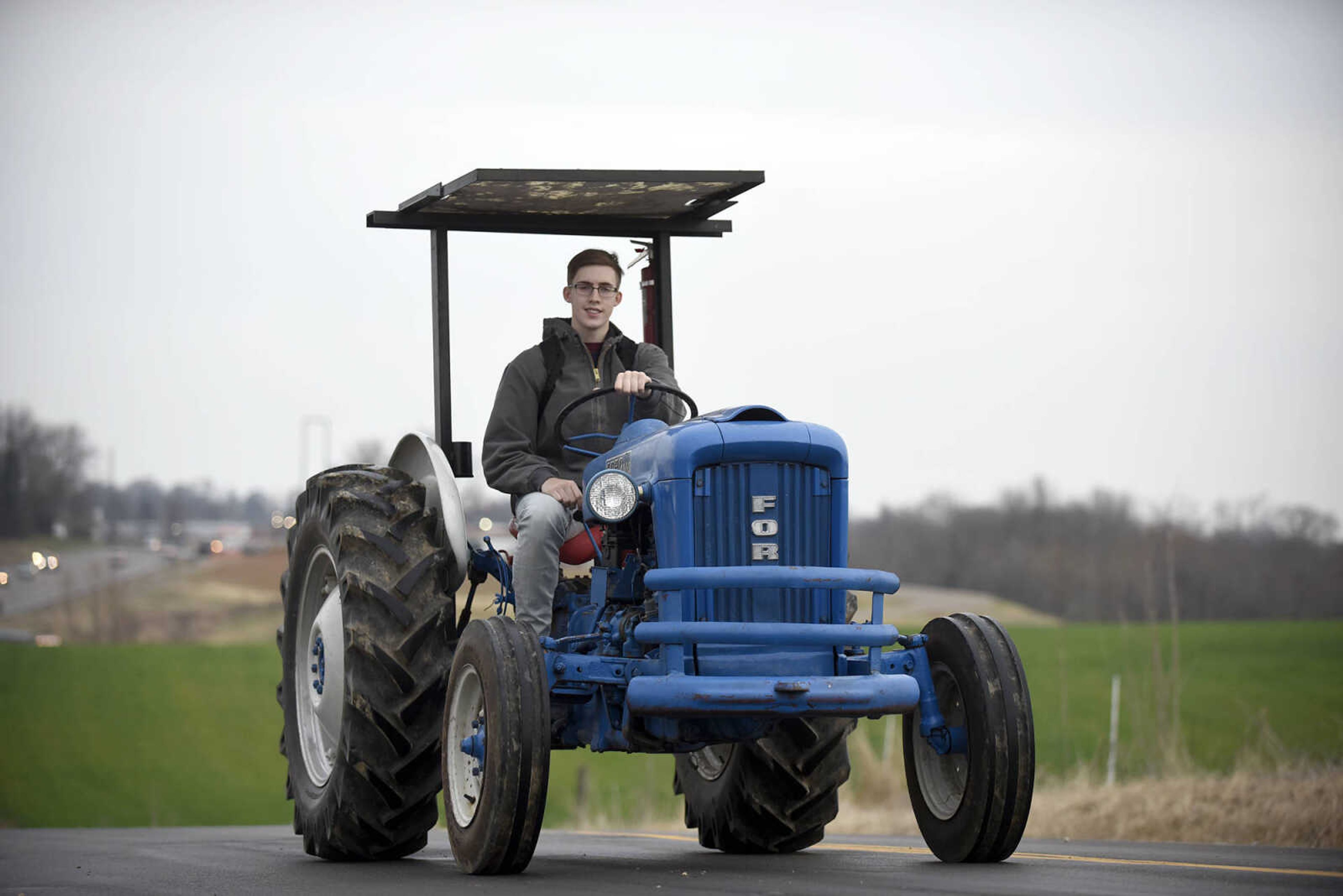 Saxony Lutheran High School FFA students take to the road on their tractors during drive your tractor to school day on Tuesday morning, Feb. 21, 2017. Students began their journey to school from Davis Farm Supply on Highway 61 in Jackson as part of FFA Week.