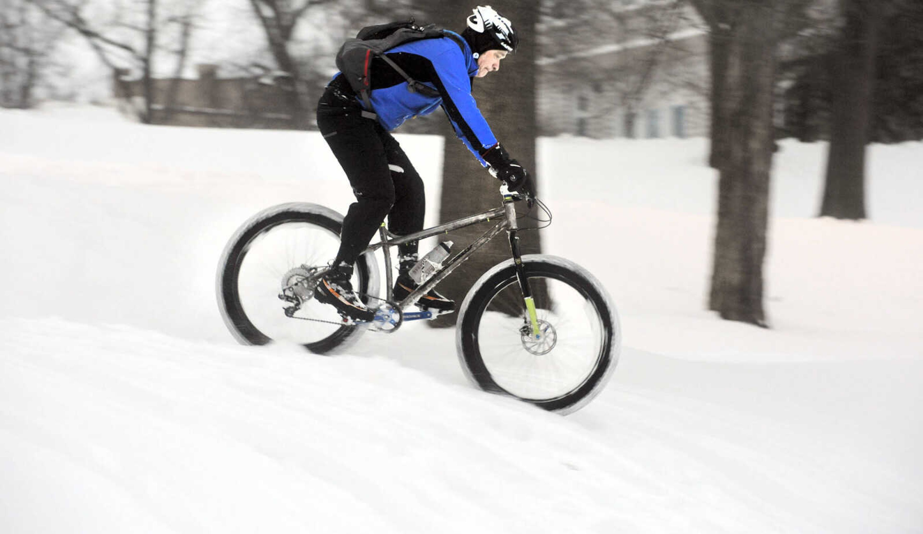 LAURA SIMON ~ lsimon@semissourian.com

John Dodd rides his fat bike through the snow on the terraces outside Academic Hall Tuesday evening, Feb. 17, 2015.