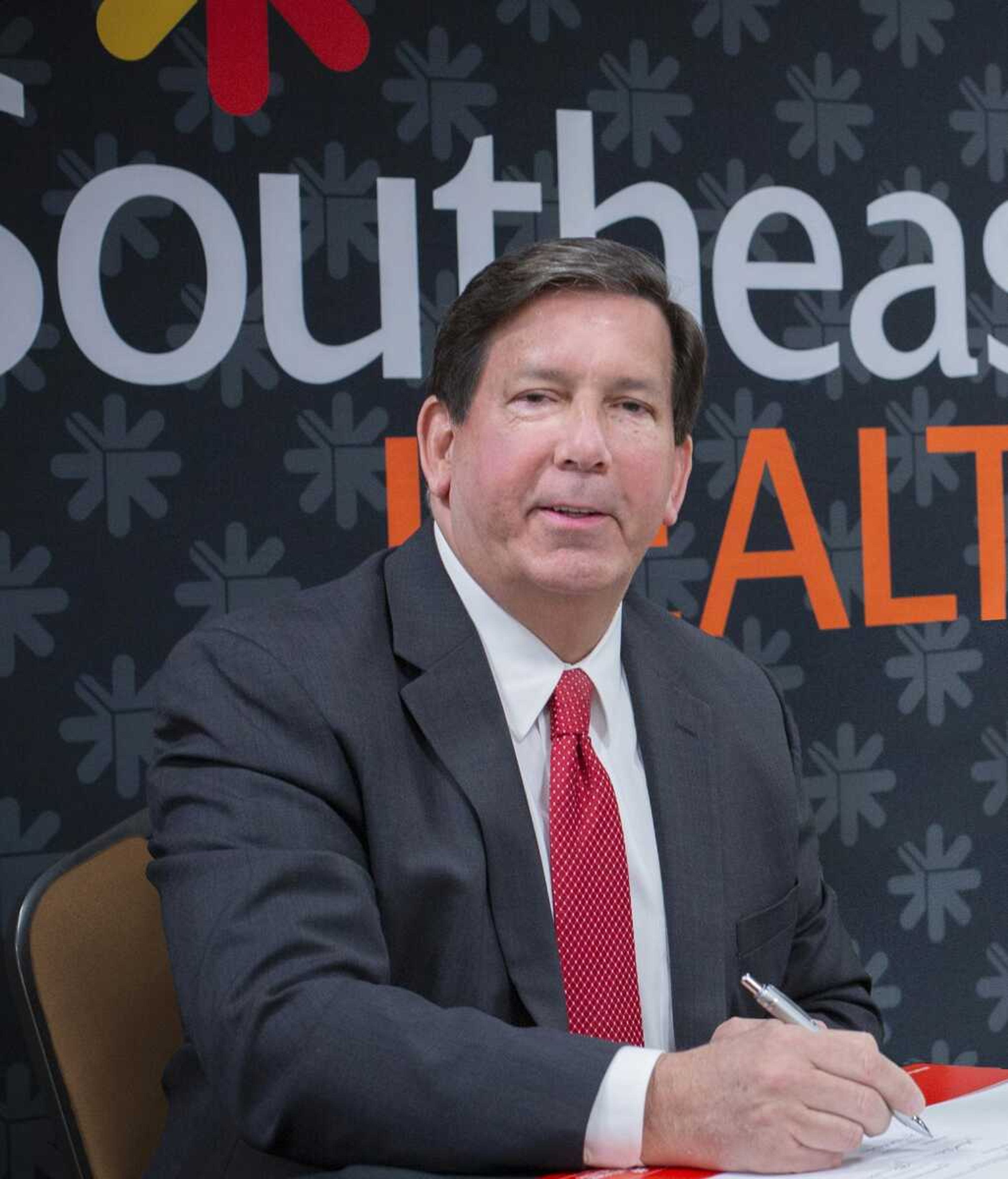 SoutheastHEALTH President and CEO Ken Bateman is shown signing the formal agreement to partner with Universal Health Services to bring critically needed behavioral health services to this region. Southeast Behavioral Health Hospital will open later this year. This is just one of more than 150 partnership contracts and collaborations intended to bring access to high quality care with significant cost savings benefits to the region.