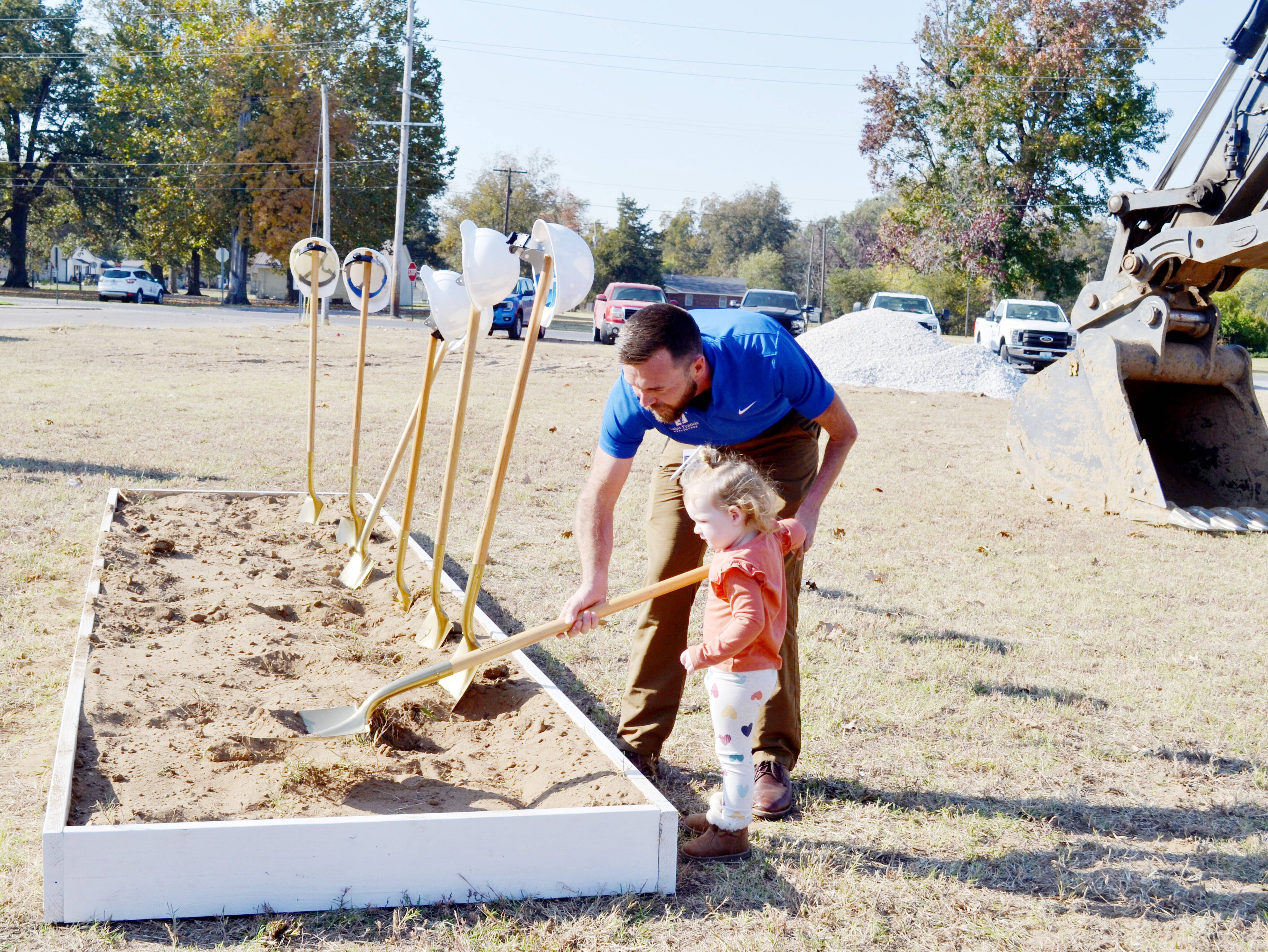 Dr. Zachary R. Barker and his daughter, Alice, turn some dirt together following the groundbreaking ceremony of Saint Francis Healthcare System’s new rural health clinic Tuesday, Oct. 29, in East Prairie.