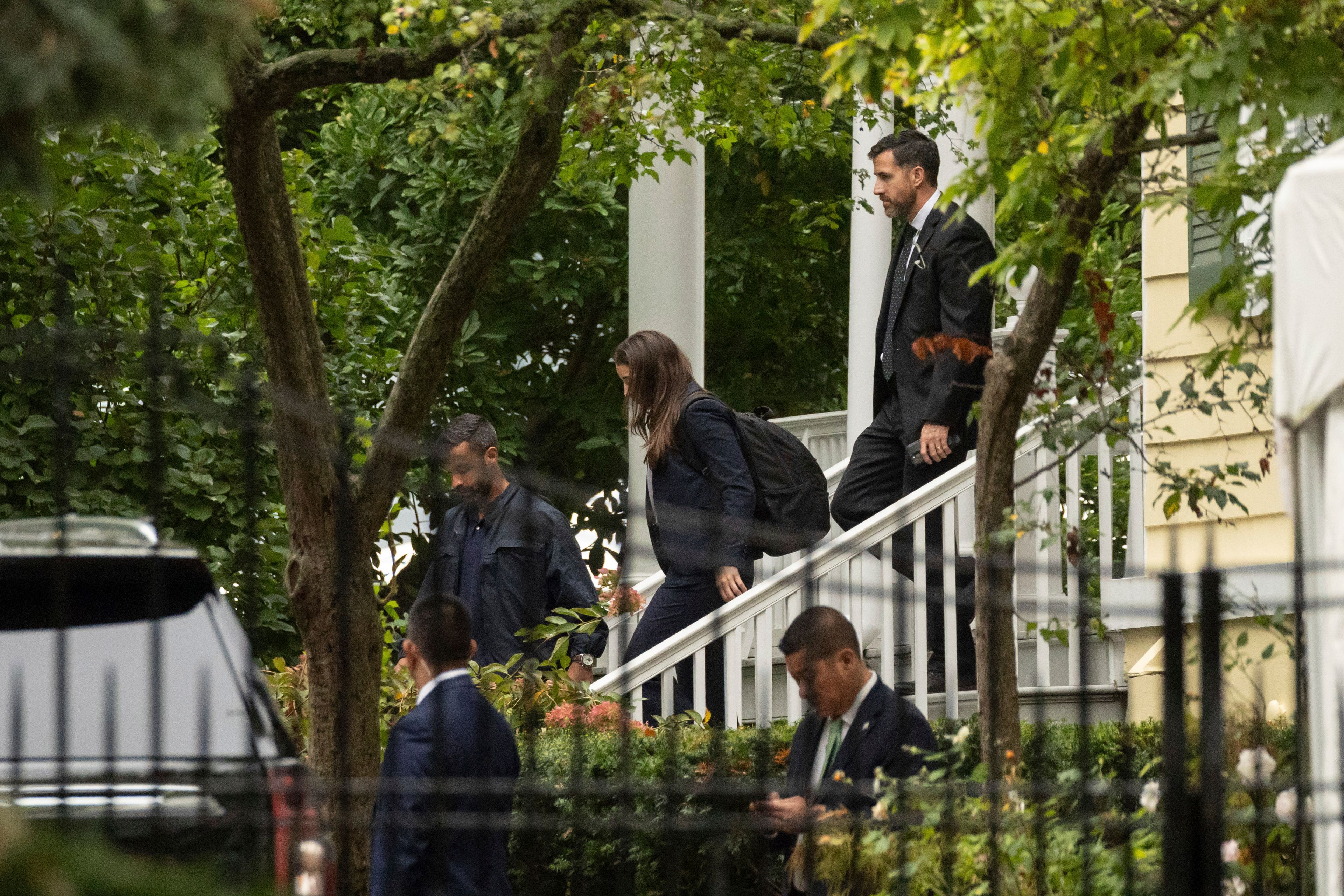 People exit Gracie Mansion, the official residence of New York City Mayor Eric Adams, Thursday, Sept. 26, 2024, in New York. (AP Photo/Yuki Iwamura)