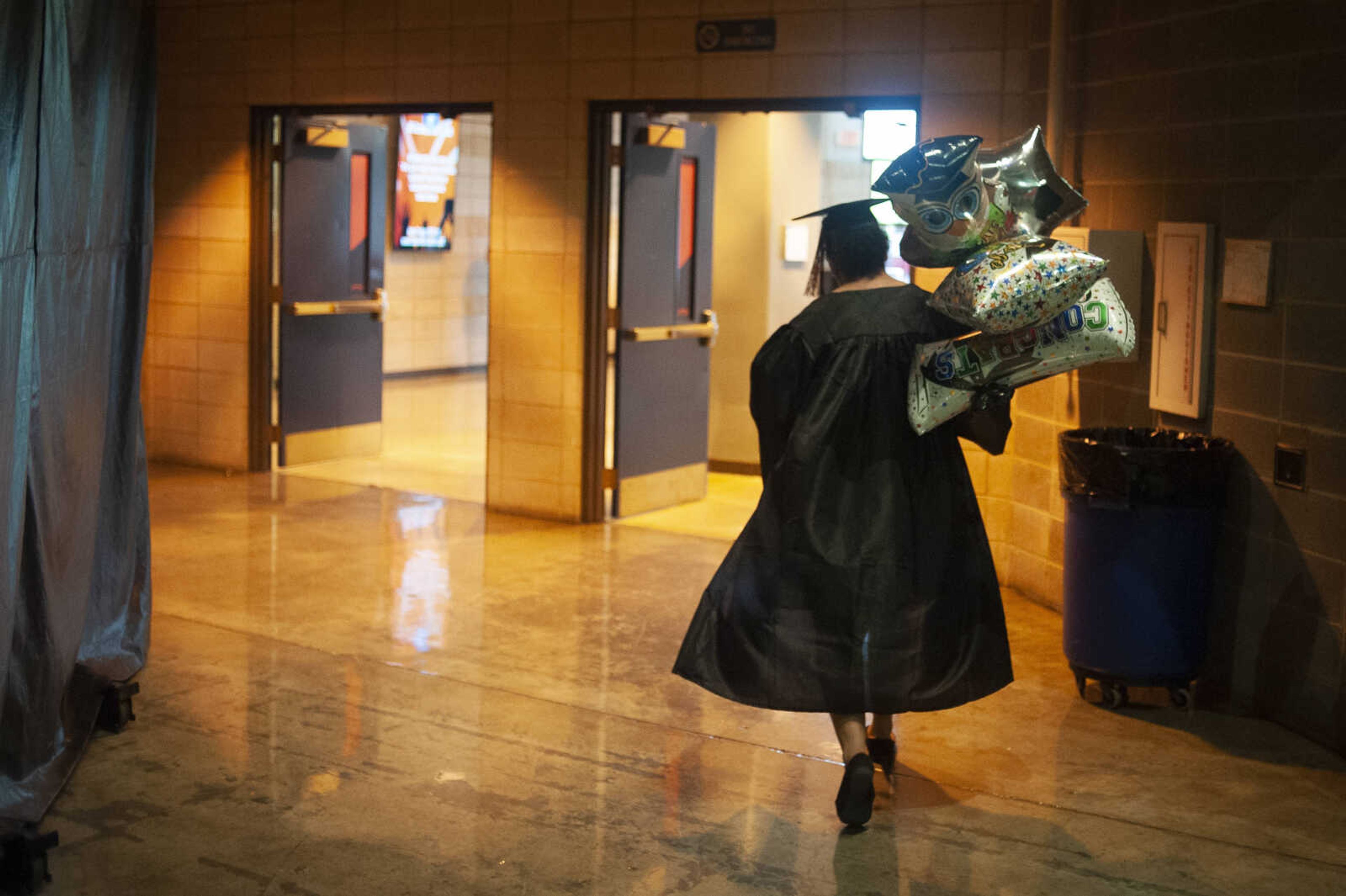 Cape Central's Destiny Ledbetter carries balloons while moving to the vestibule area following Cape Central High School's Class of 2019 Commencement on Sunday, May 12, 2019, at the Show Me Center in Cape Girardeau.