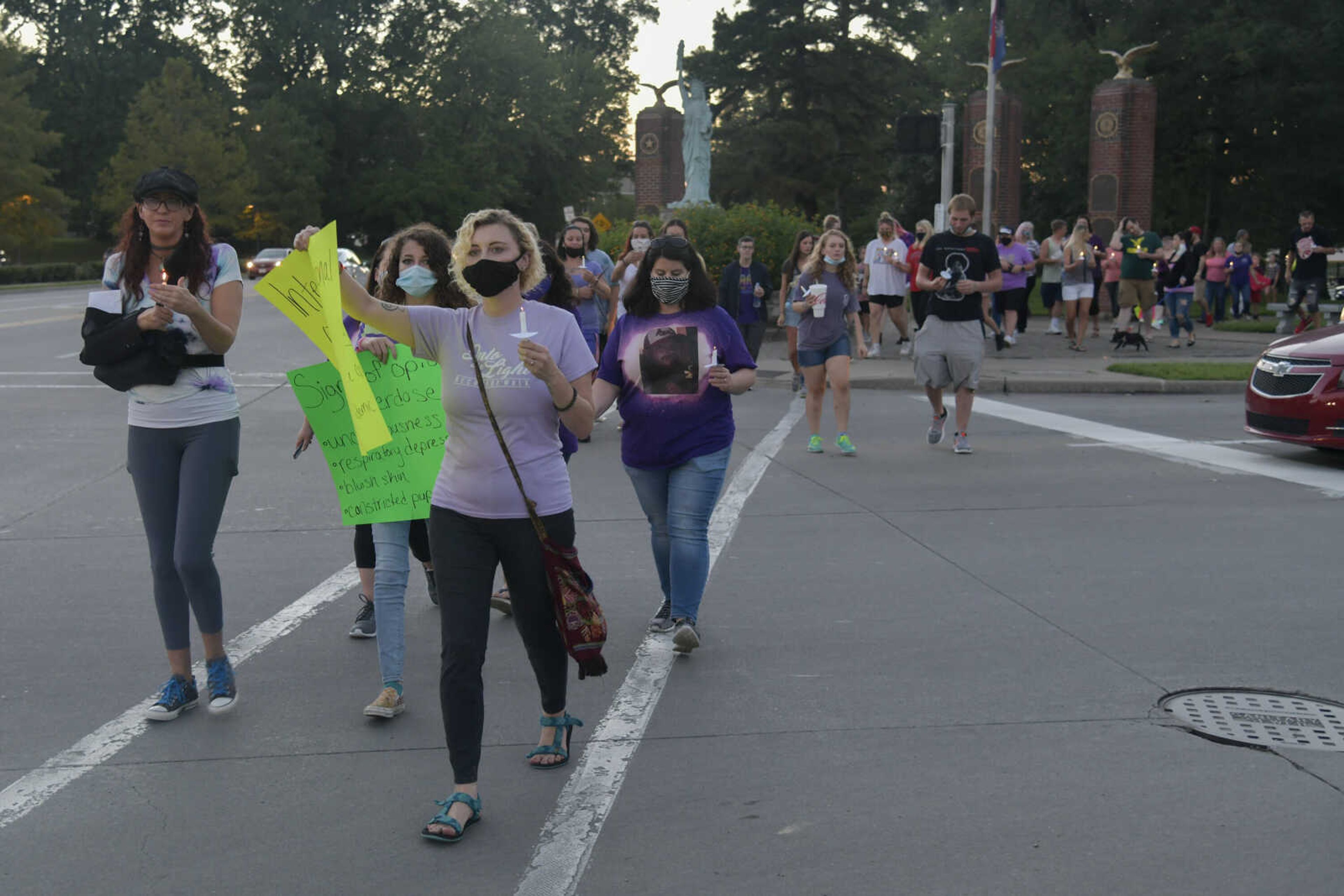 Front, Iris Anderson leads the International Overdose Awareness Day Honor Walk from Freedom Corner in Capaha Park on Monday, Aug. 31, 2020.