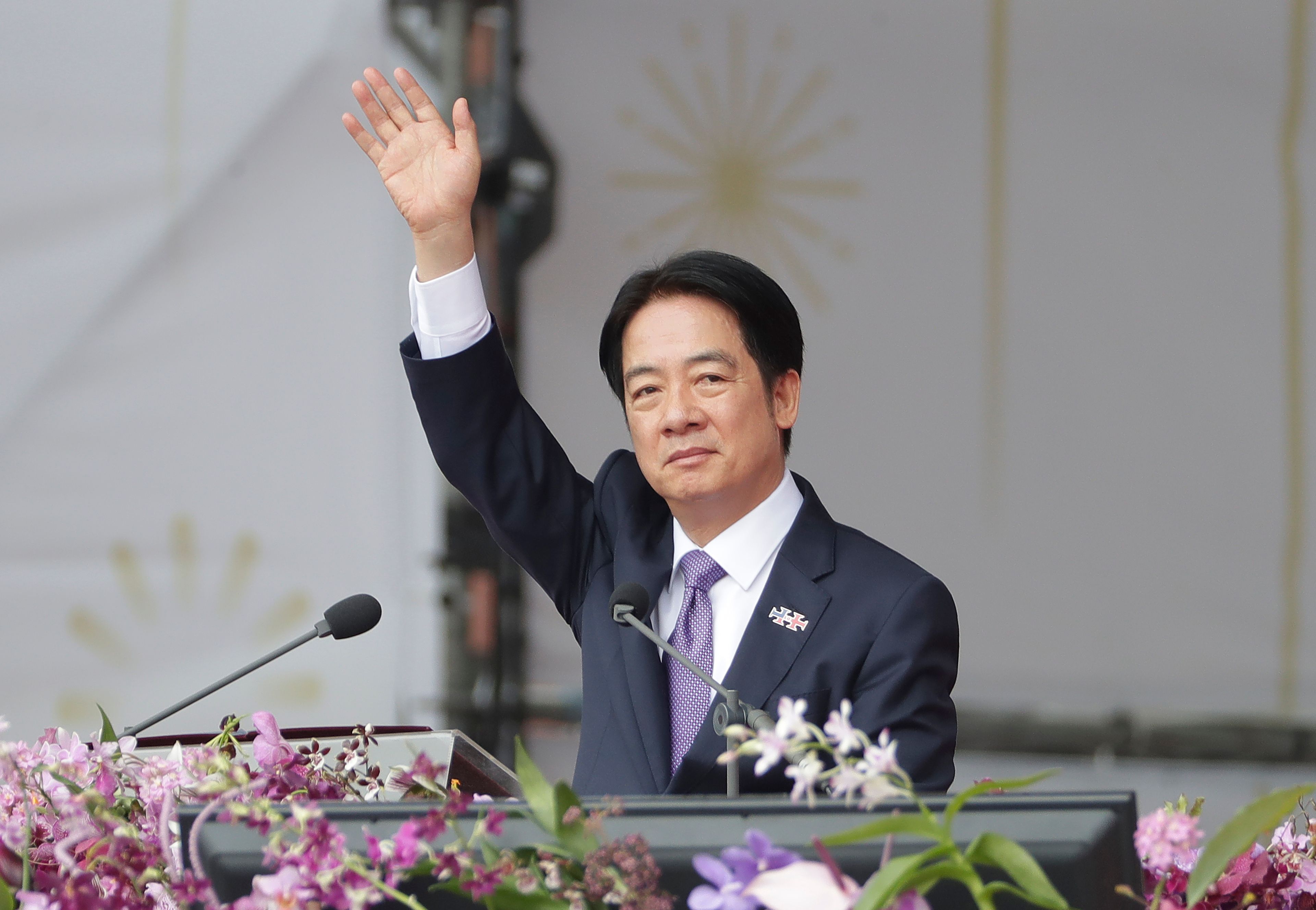 Taiwanese President Lai Ching-te waves during National Day celebrations in front of the Presidential Building in Taipei, Taiwan, Thursday, Oct. 10, 2024. (AP Photo/Chiang Ying-ying)