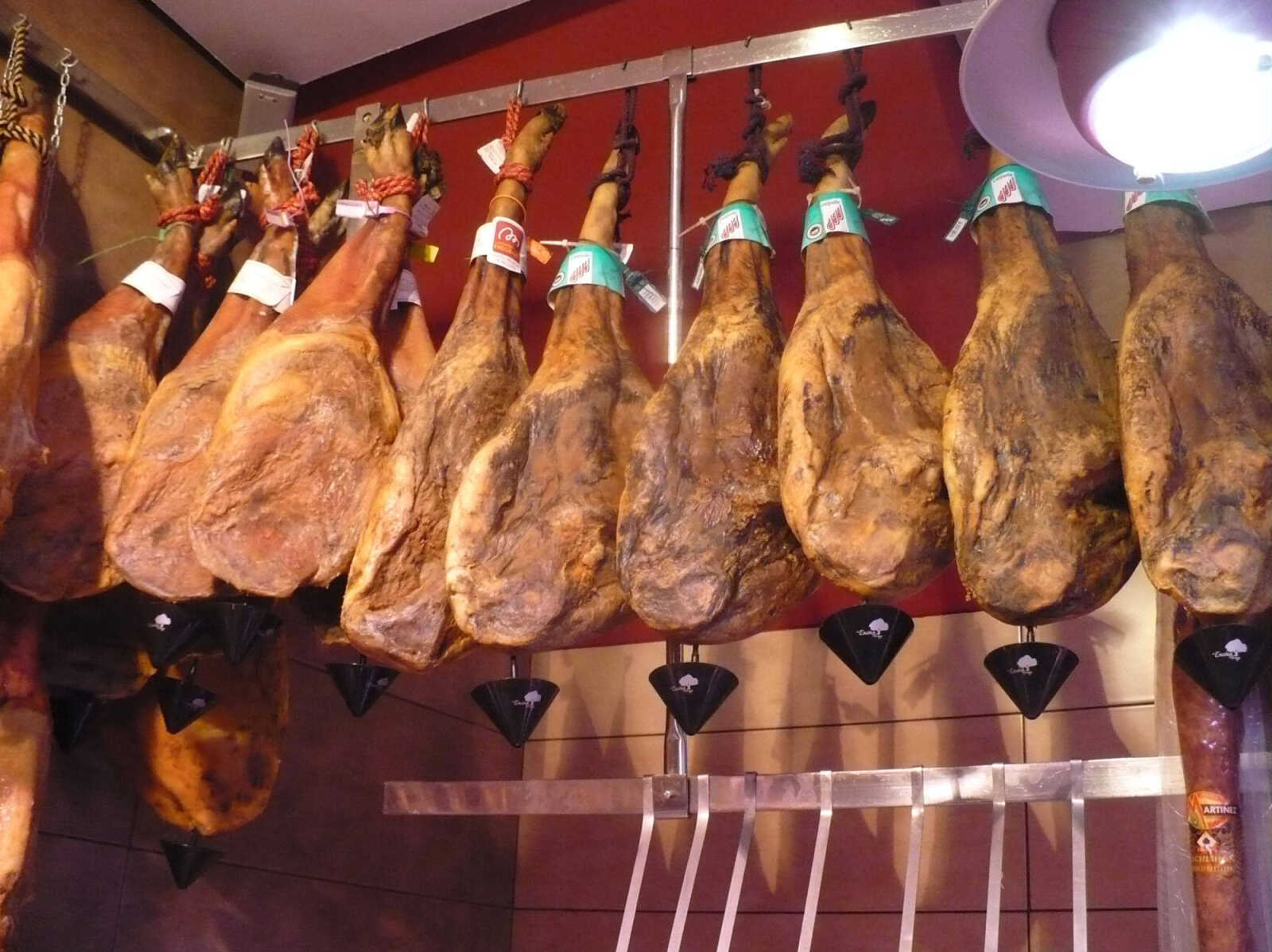 TOM HARTE ~ photos@semissourian.com
Cured hams hang from the ceiling of a typical Spanish cafe.