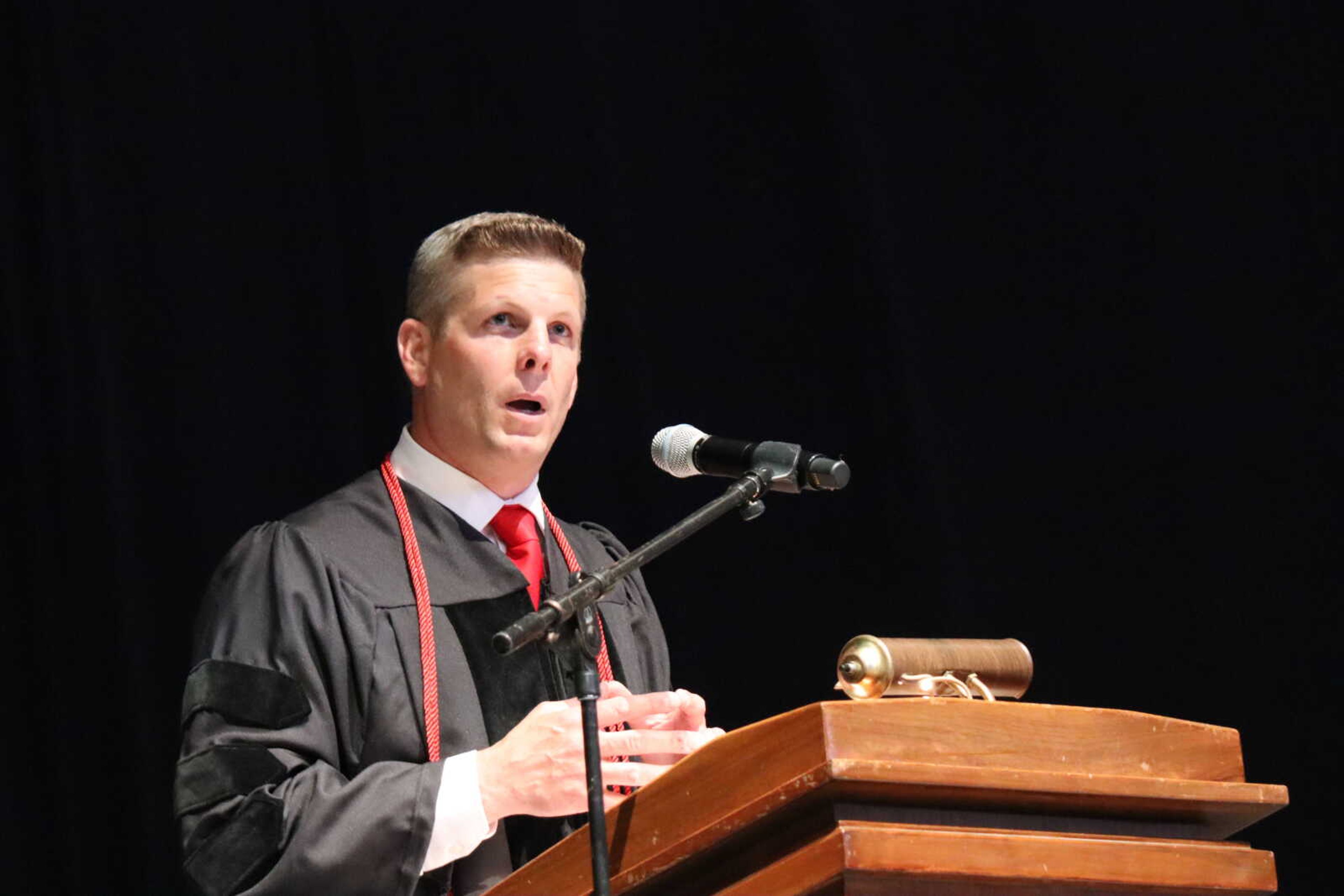 Principal Seth Harrell welcomes everyone attendance to the commencement ceremony at the Show Me Center.