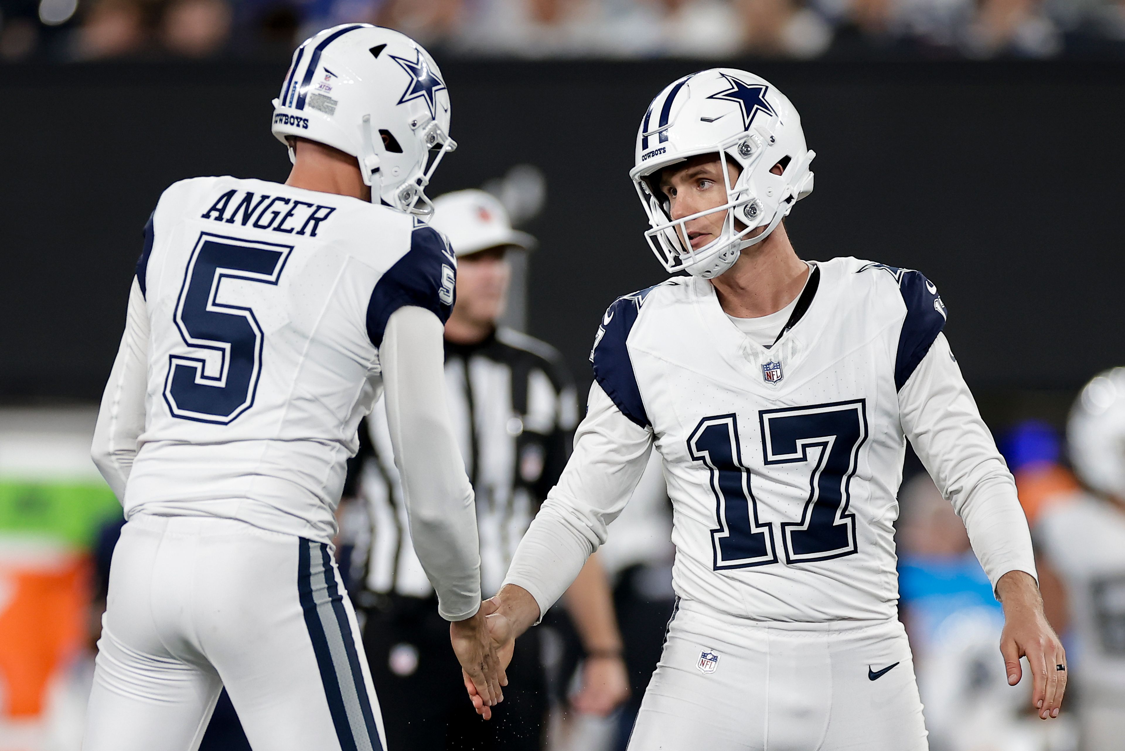 Dallas Cowboys place kicker Brandon Aubrey (17) is congratulated by punter Bryan Anger (5) after kicking a 40-yard field goal against the New York Giants during the fourth quarter of an NFL football game, Thursday, Sept. 26, 2024, in East Rutherford, N.J. (AP Photo/Adam Hunger)