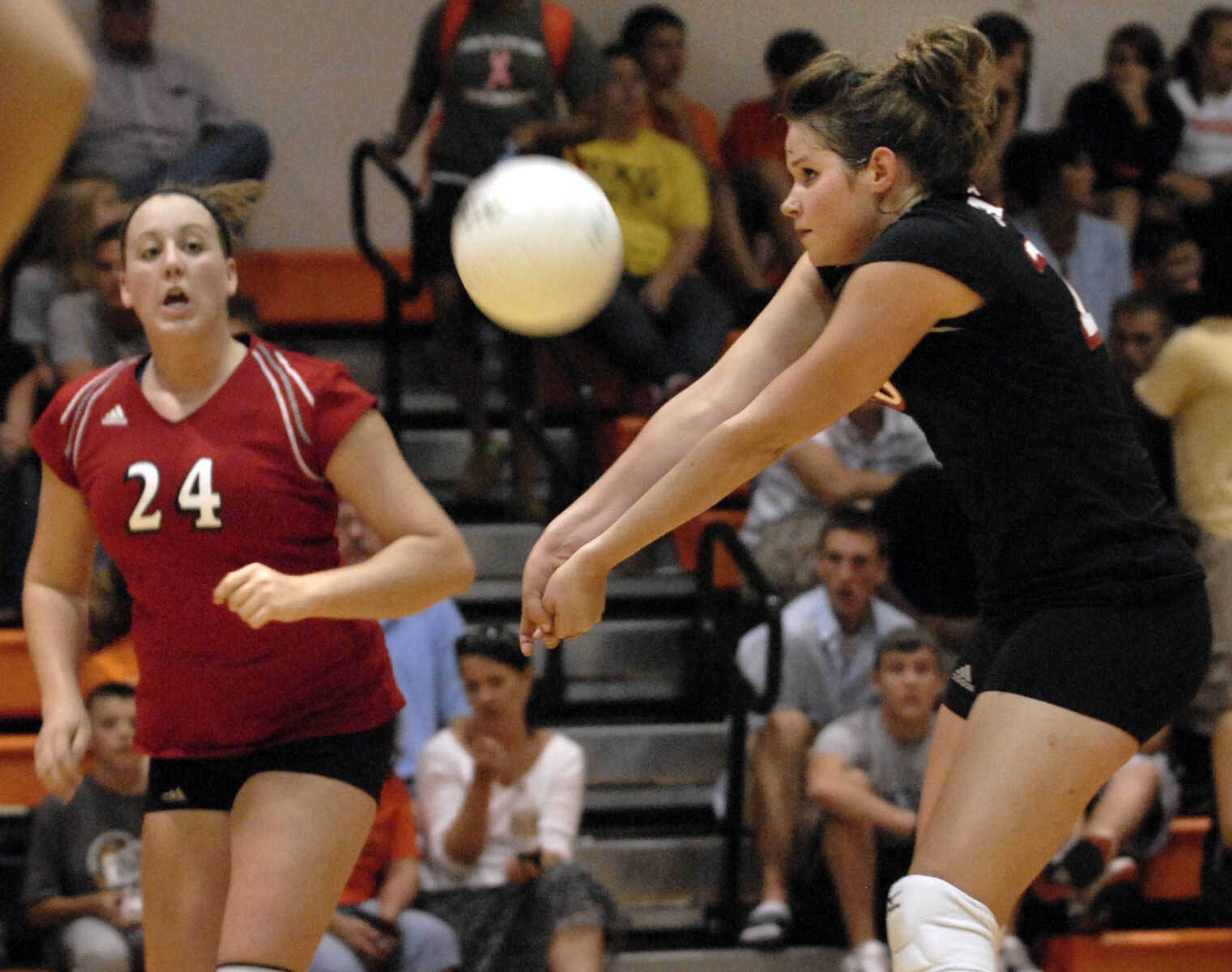 FRED LYNCH ~ flynch@semissourian.com
Jackson's Cassandra Bollinger passes the ball as Jill Rushin looks on in the second game against Central Wednesday at Central.