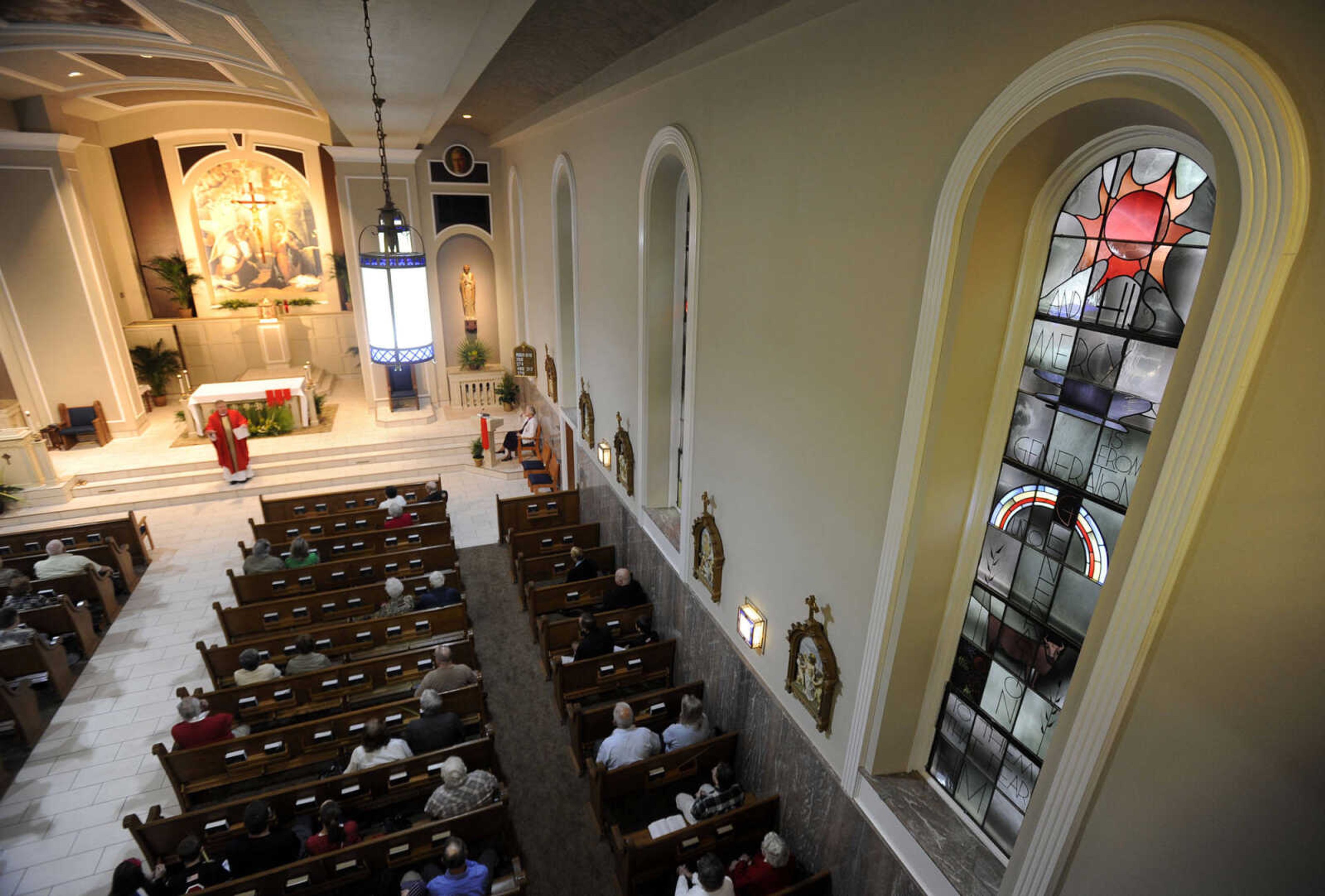 Parishioners worship during the first Mass since renovation of St. Mary Cathedral on Sunday, April 13, 2014 in Cape Girardeau.