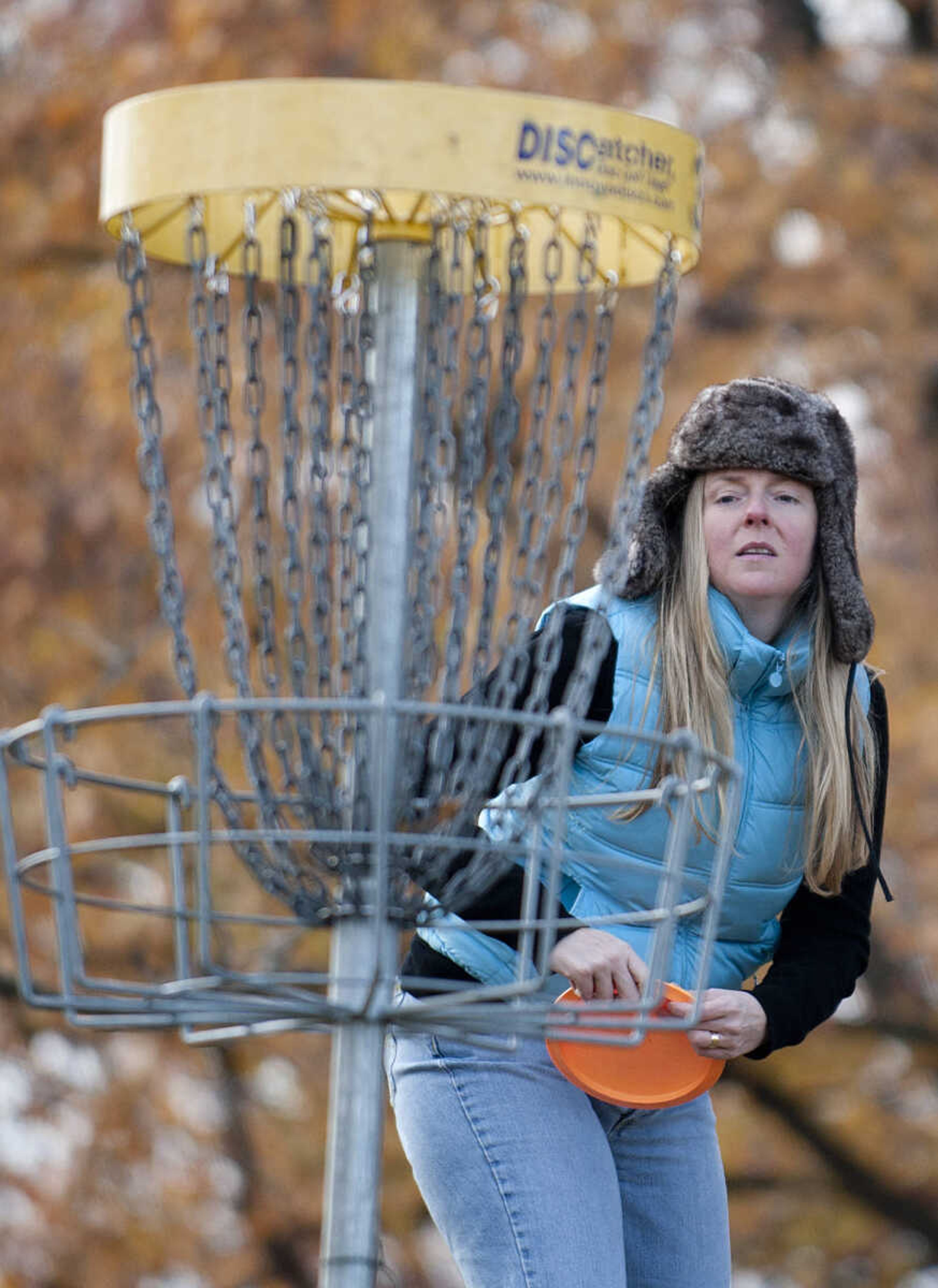 Jennifer Wenger prepares to make a putt during the Fountain of Life Disc Golf Tournament Sunday, Nov. 24, at Capaha Park in Cape Girardeau. Organizers estimated that approximately 30 people played in the tournament which raised around $2,500 which will go towards construction of a fresh water well for a village in Swaziland, Africa.