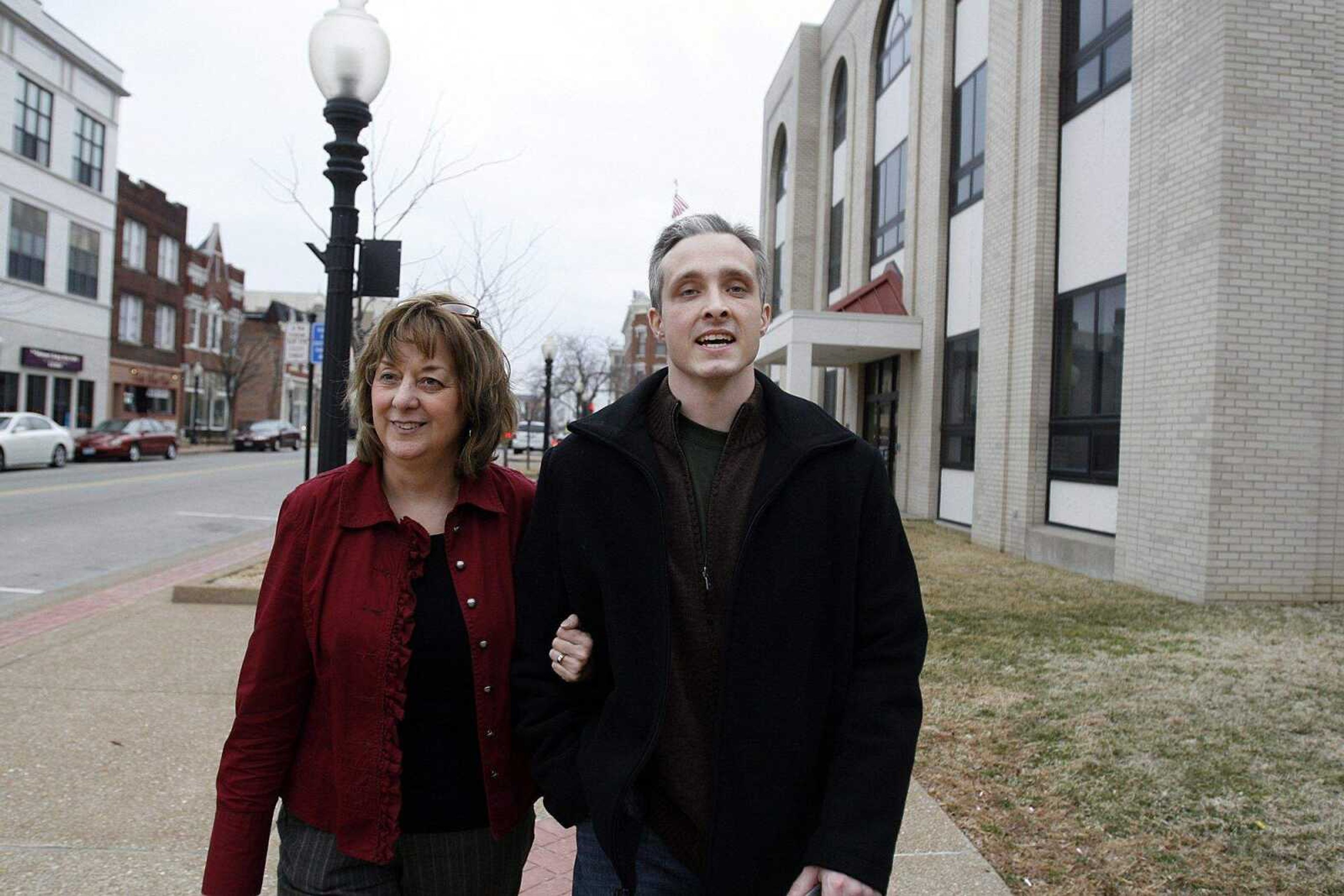 ELIZABETH DODD ~ edodd@semissourian.com
After visiting Judge Callahan at the Cole County Courthouse, Joshua Kezer walks down the street in Jefferson City with Jane Williams whom Kezer calls his "other mom."