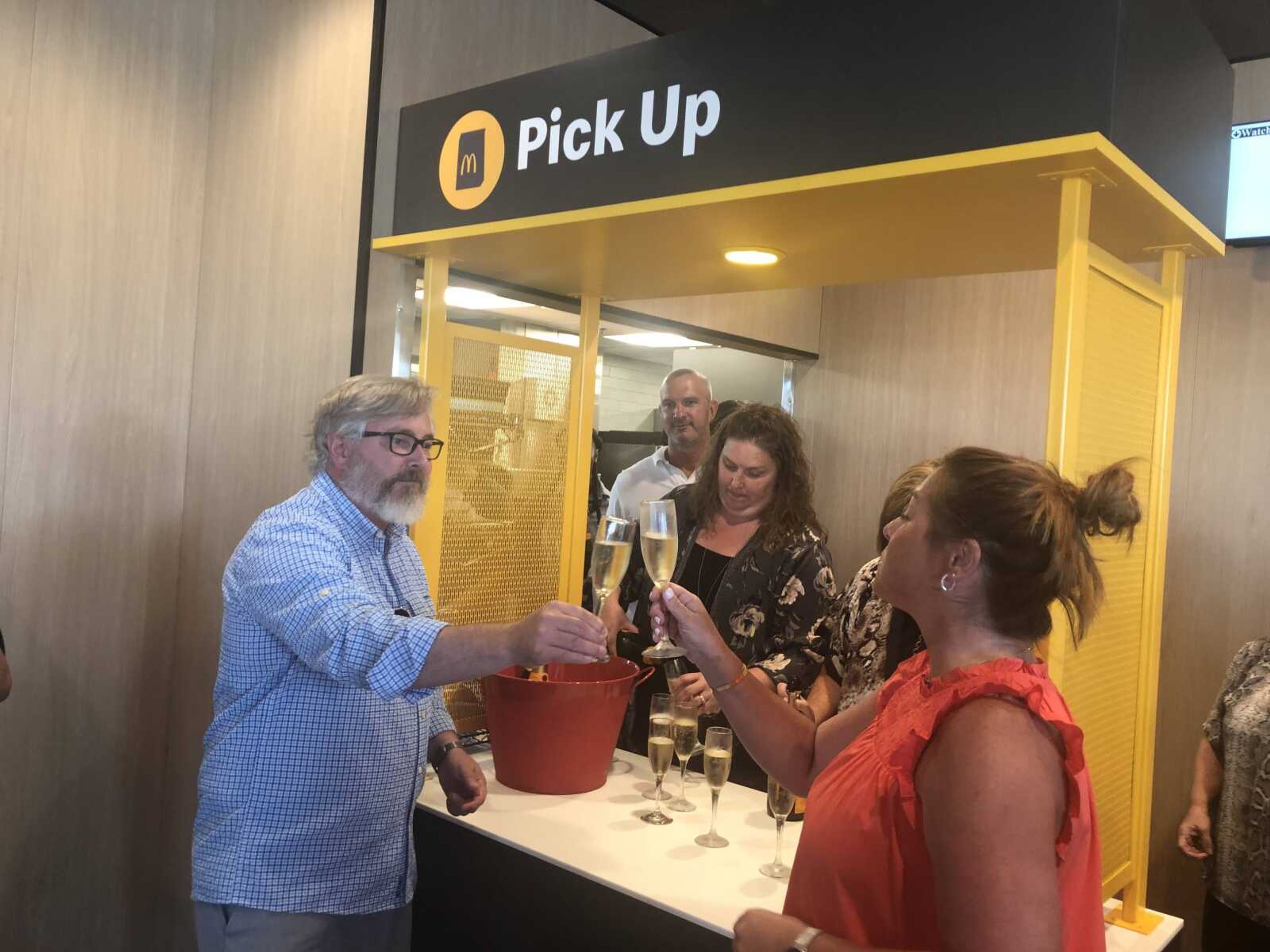 Shannon Davis, left, toasts his wife Angie Davis, right, at the couple's new McDonald's location on North Kingshighway in Cape Girardeau. This is the third McDonald's in Cape Girardeau and the 18th location in Southeast Missouri for Davis.