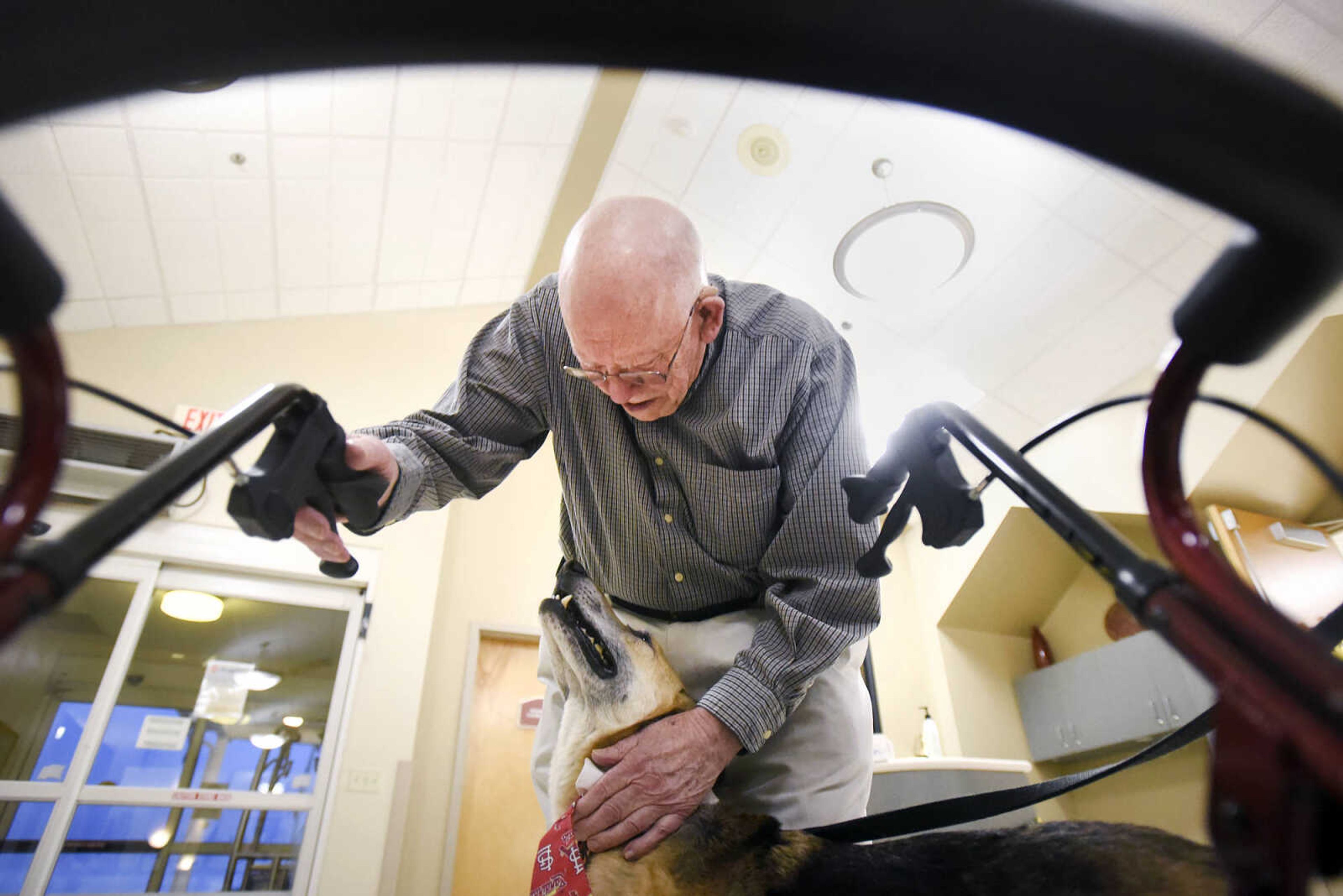 Ron Shannon visits with Max on Tuesday, Feb. 21, 2017, during the Pet Pals stop at the Missouri Veteran's Home in Cape Girardeau.