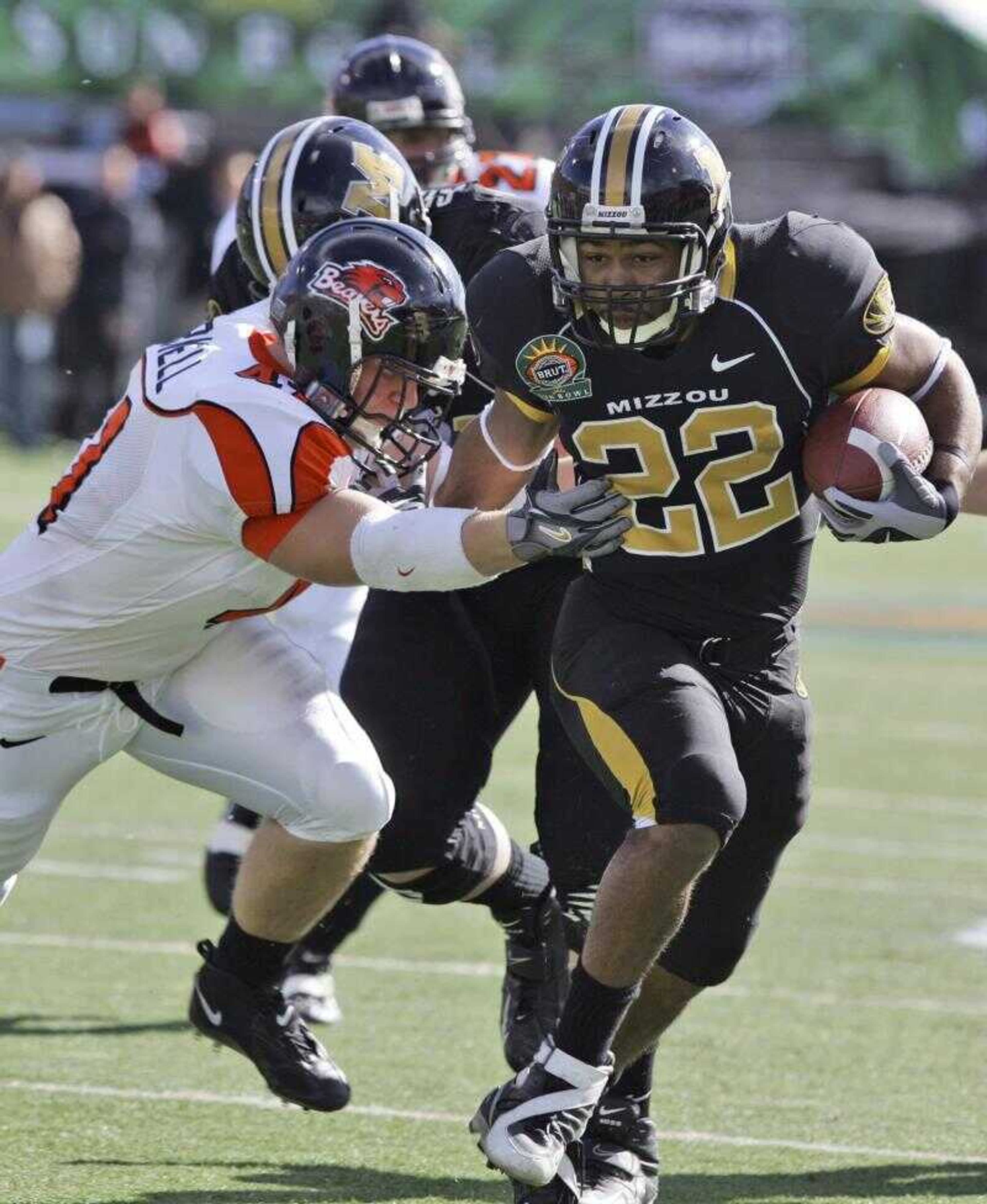 Missouri running back Tony Temple (22) broke a tackle against Oregon State linebacker Bryant Cornell (41) during the Sun Bowl football game Friday in El Paso, Texas. (L.M. OTERO ~ Associated Press)