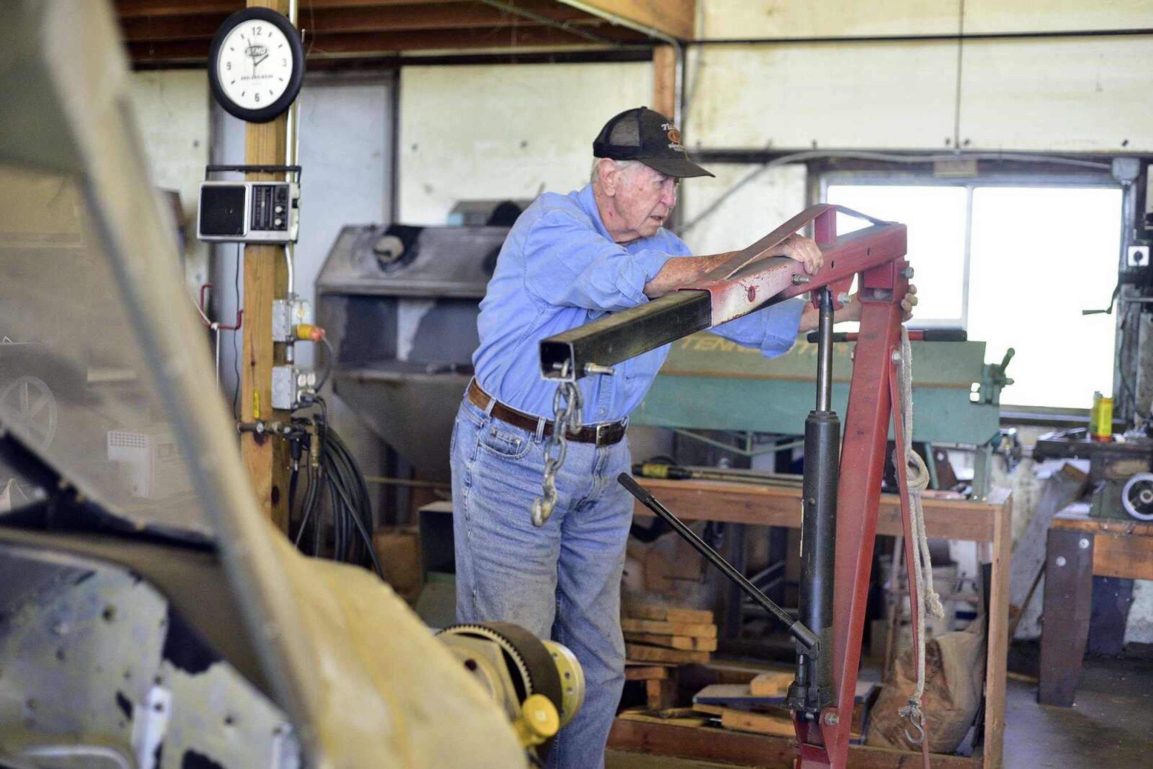 John Farquhar, or known to most as "Papa John" spends most of his days tinkering inside the hangar that houses Cape Copters at the Cape Girardeau Regional Airport.