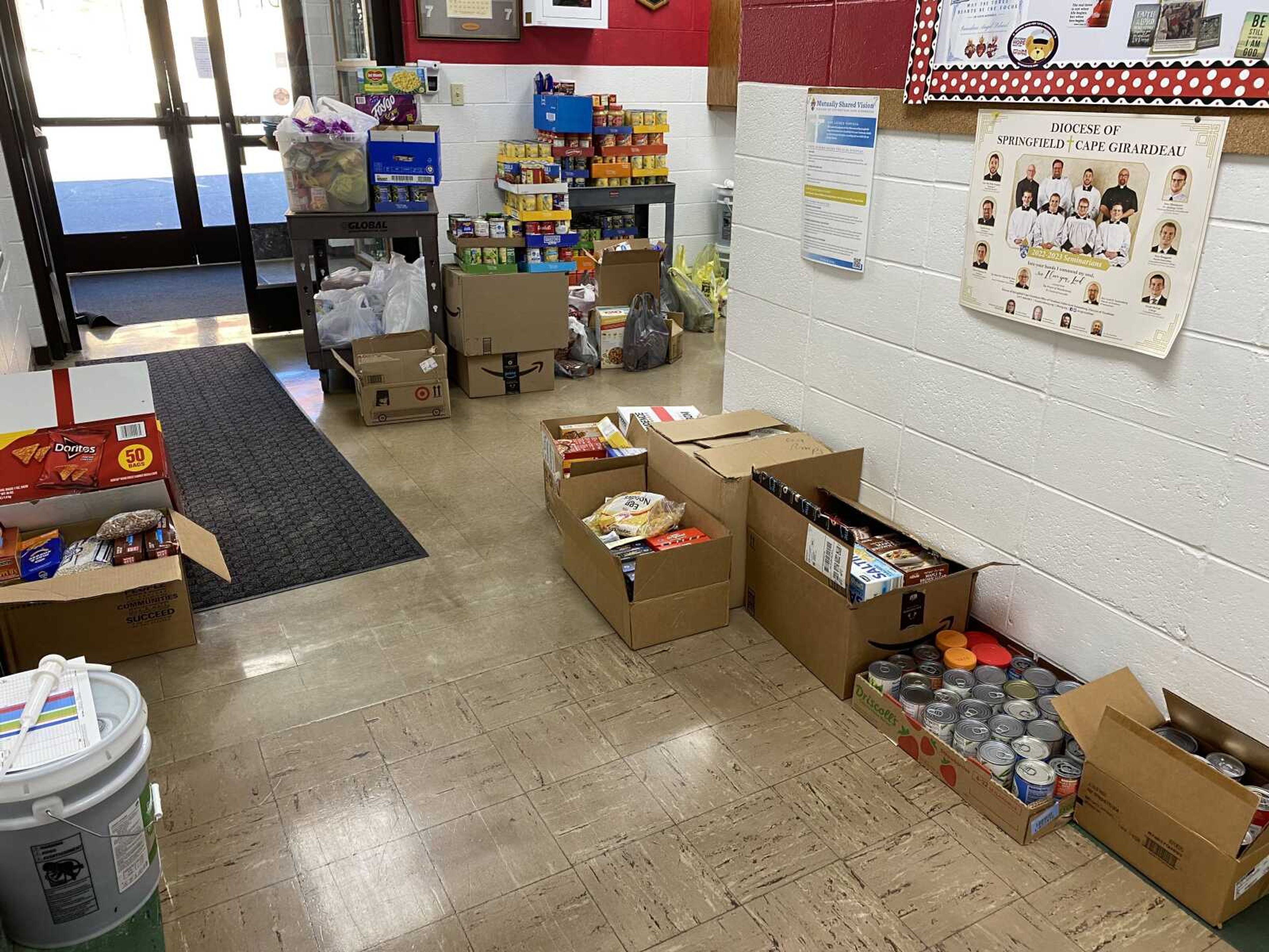 The Guardian Angel students had carried the food that was collected from the 3 classrooms, that were collection points, to the entryway to make it easier for the food to be carried out by Ms. Daniel and the high school students of Oran Public.