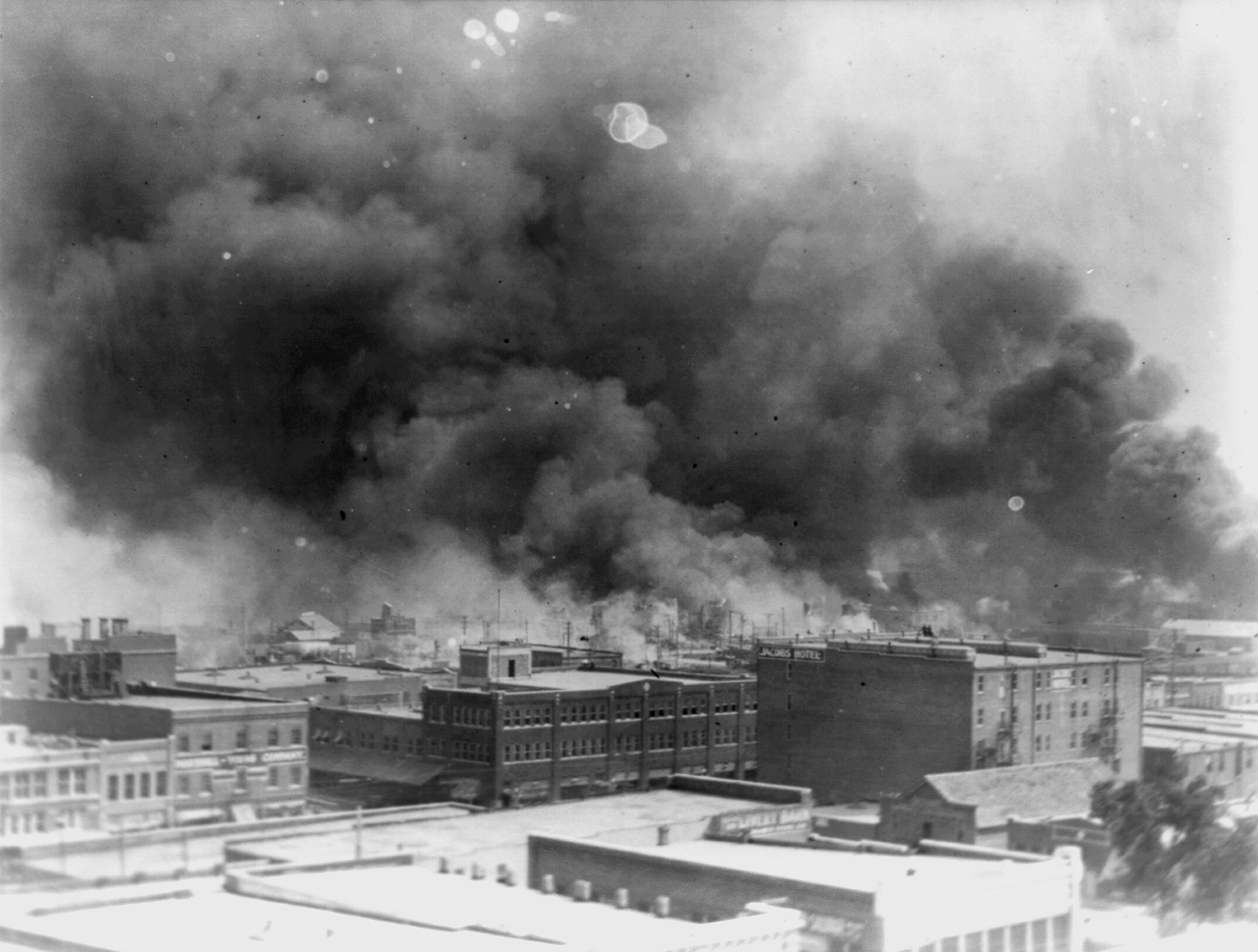 FILE - In this 1921 image provided by the Library of Congress, smoke billows over Tulsa, Okla. (Alvin C. Krupnick Co./Library of Congress via AP, File)