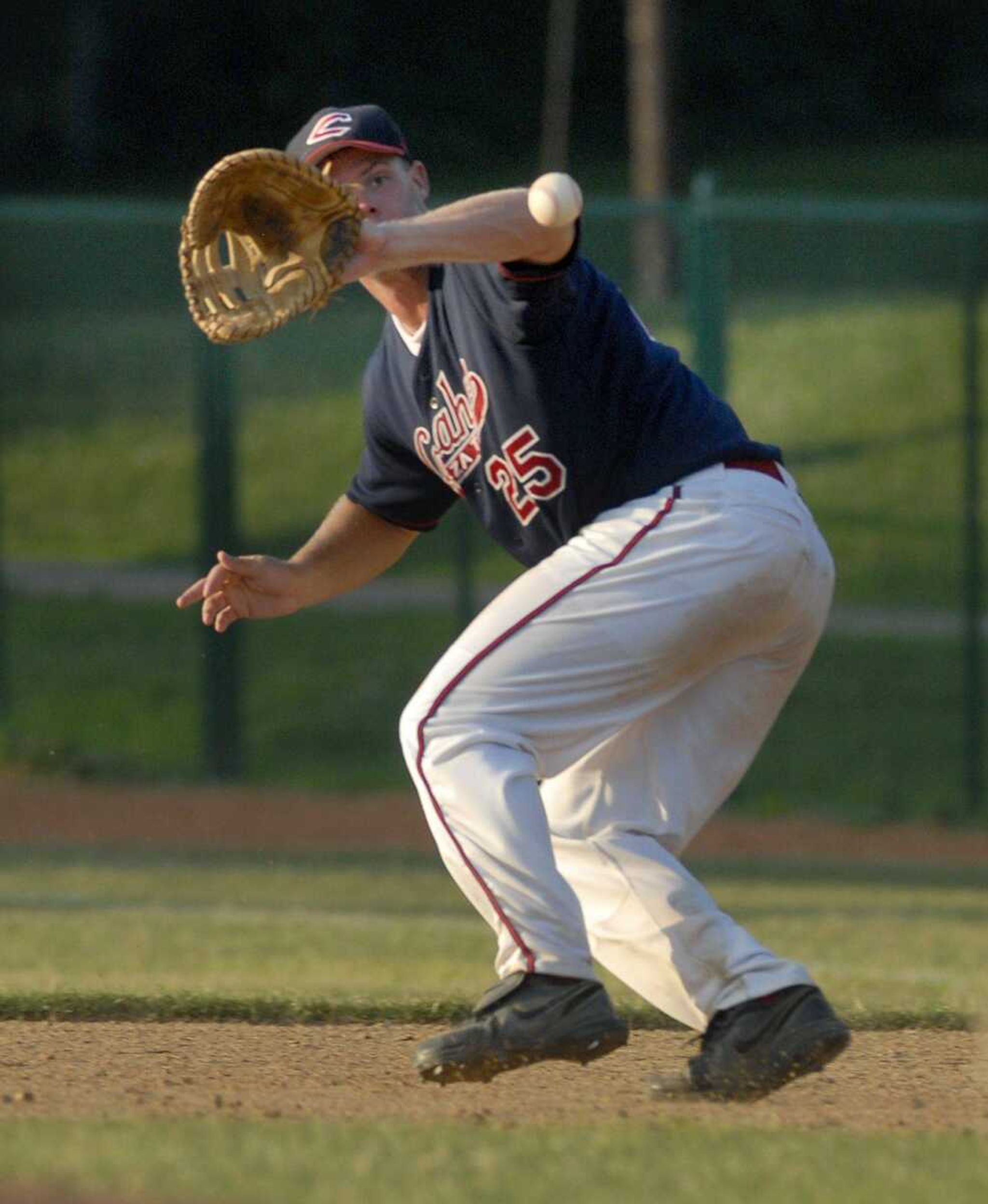 Capahas' Sean Bard attempts to catch the ball for an out at first base in the sixth inning against the Panthers Saturday at Capaha Park. (Elizabeth Dodd)