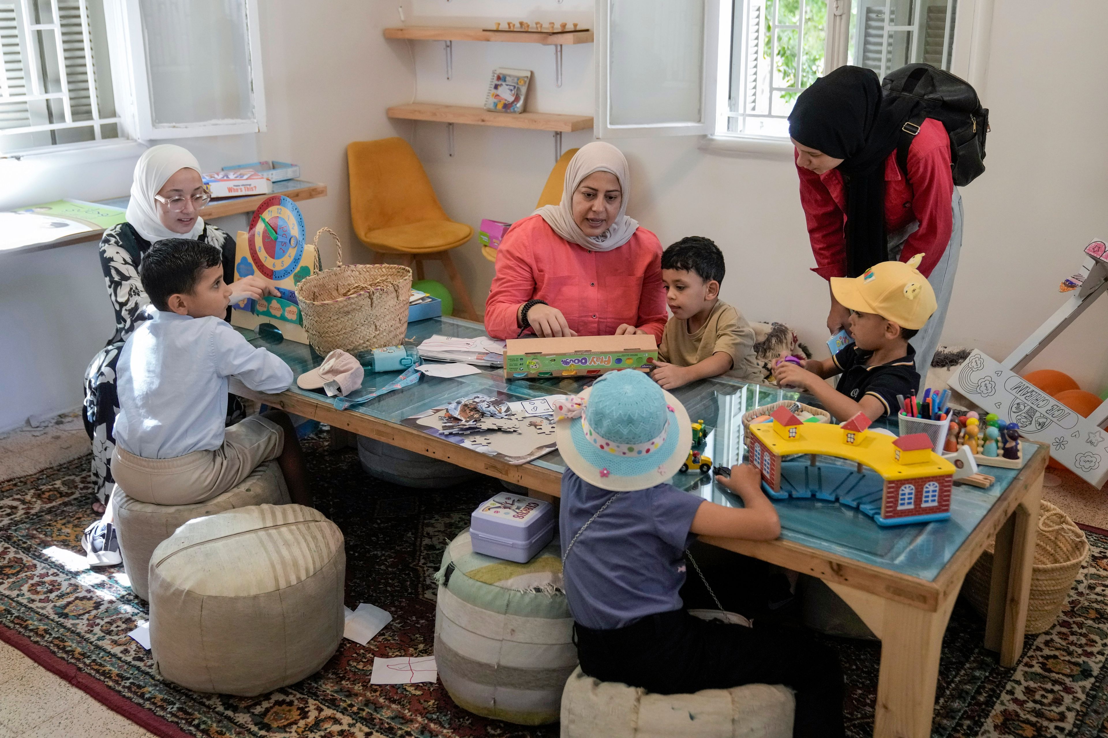 Palestinian children who were brought to Lebanon from the Gaza Strip for treatment, play at a summer camp in Beirut, Lebanon, Friday, Aug. 30, 2024. (AP Photo/Bilal Hussein)