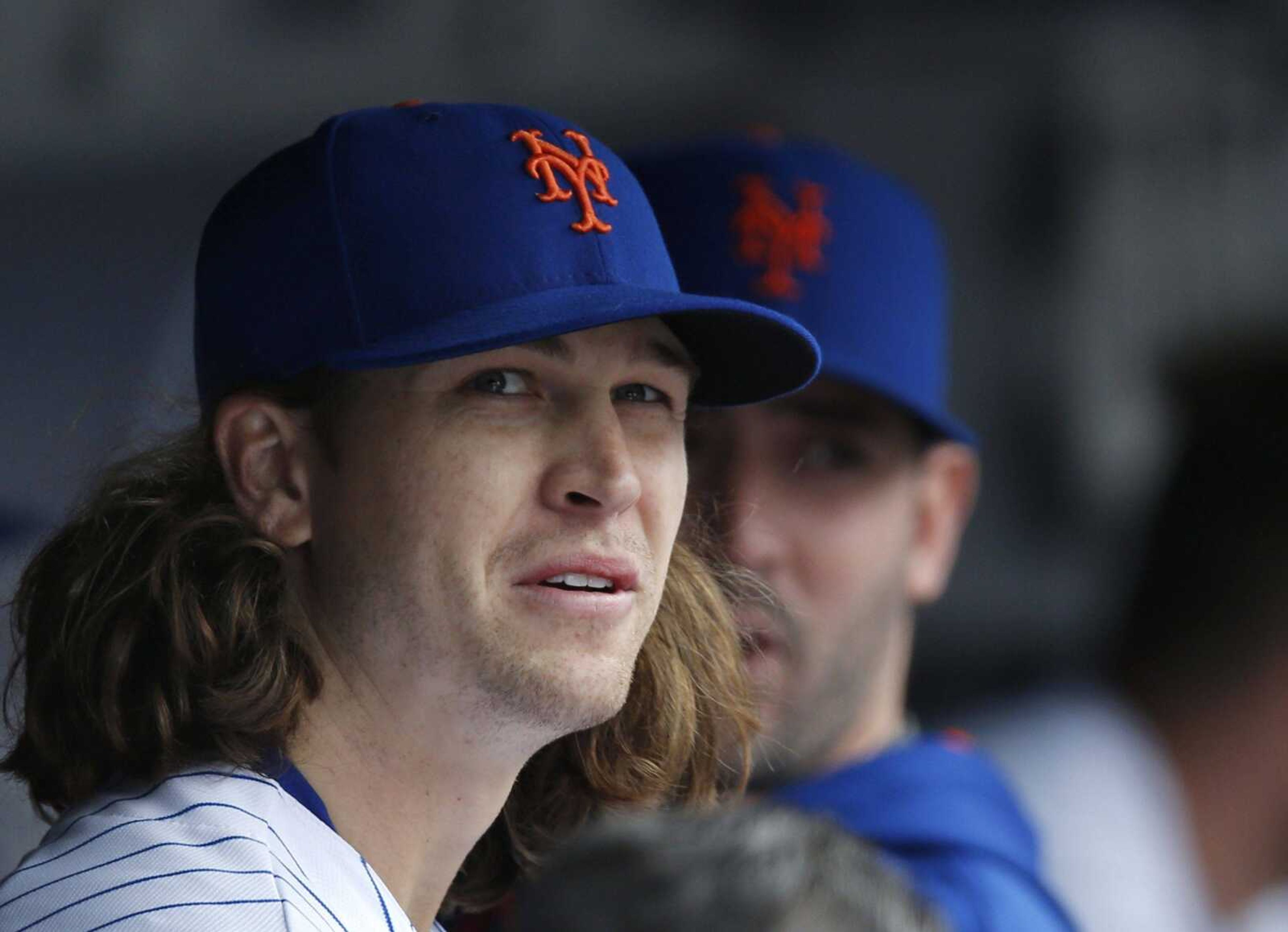 Mets starting pitcher Jacob deGrom watches from the dugout after being lifted after eight innings. The right-hander struck out 11 Cardinals, allowed one hit and no runs.