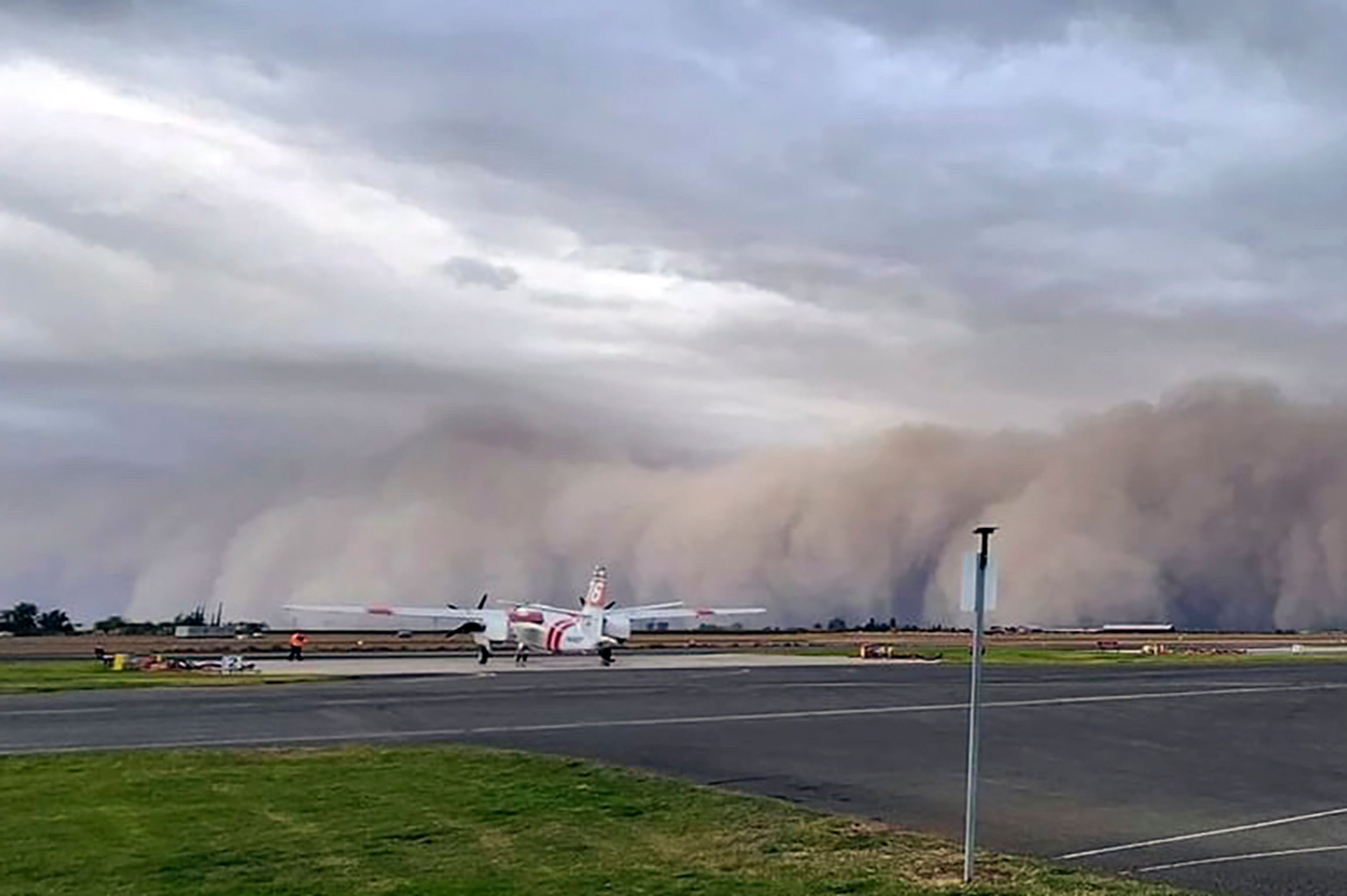 This photograph, provided by CAL FIRE Tulare Unit, shows a dust storm approaching the Porterville Air Attack Base Monday, Nov. 11, 2024 outside of Porterville, Calif. (CAL FIRE Tulare Unit via AP)