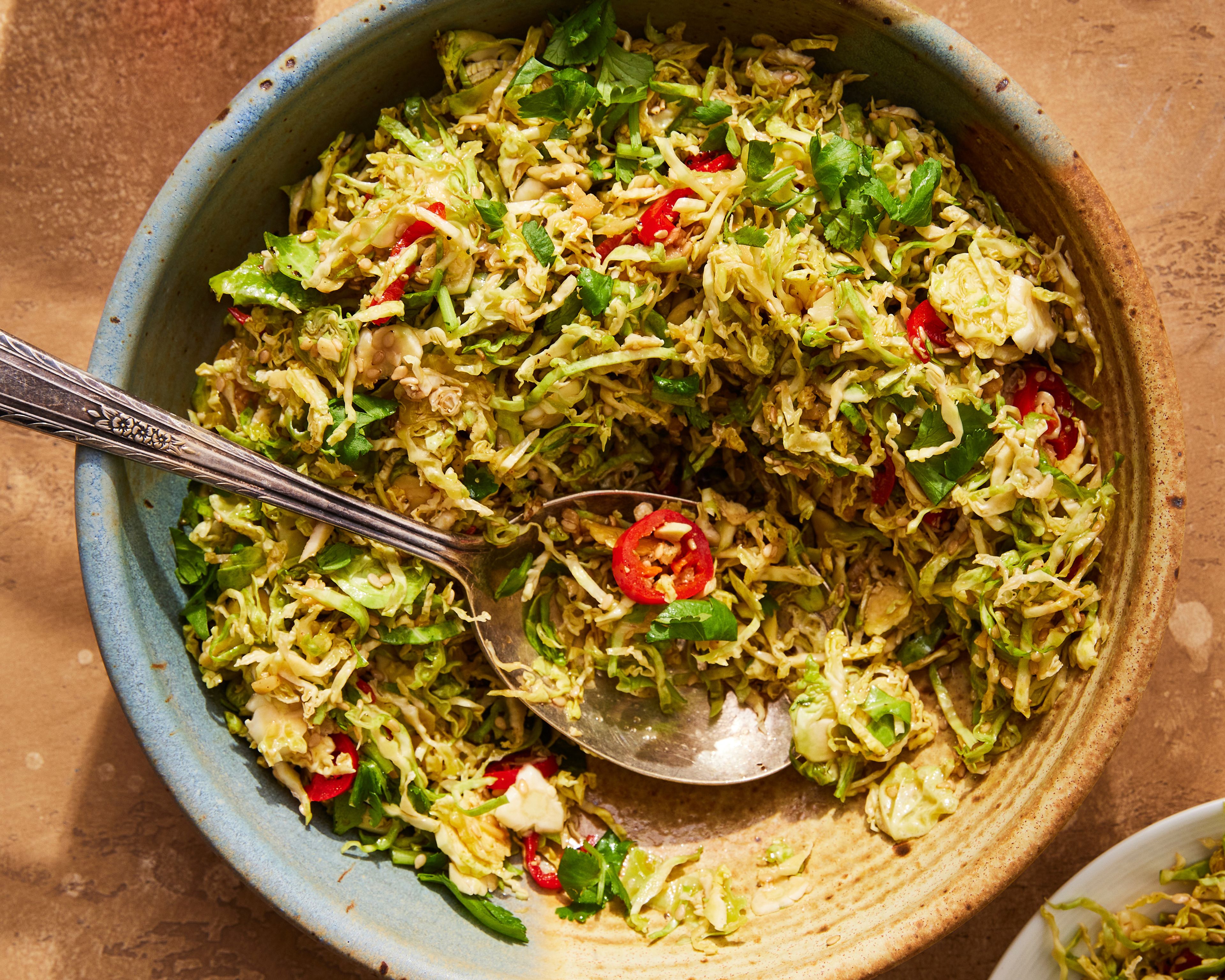 This image released by Milk Street shows a recipe for hot-oil Brussels sprouts with ginger and sesame. (Milk Street via AP)