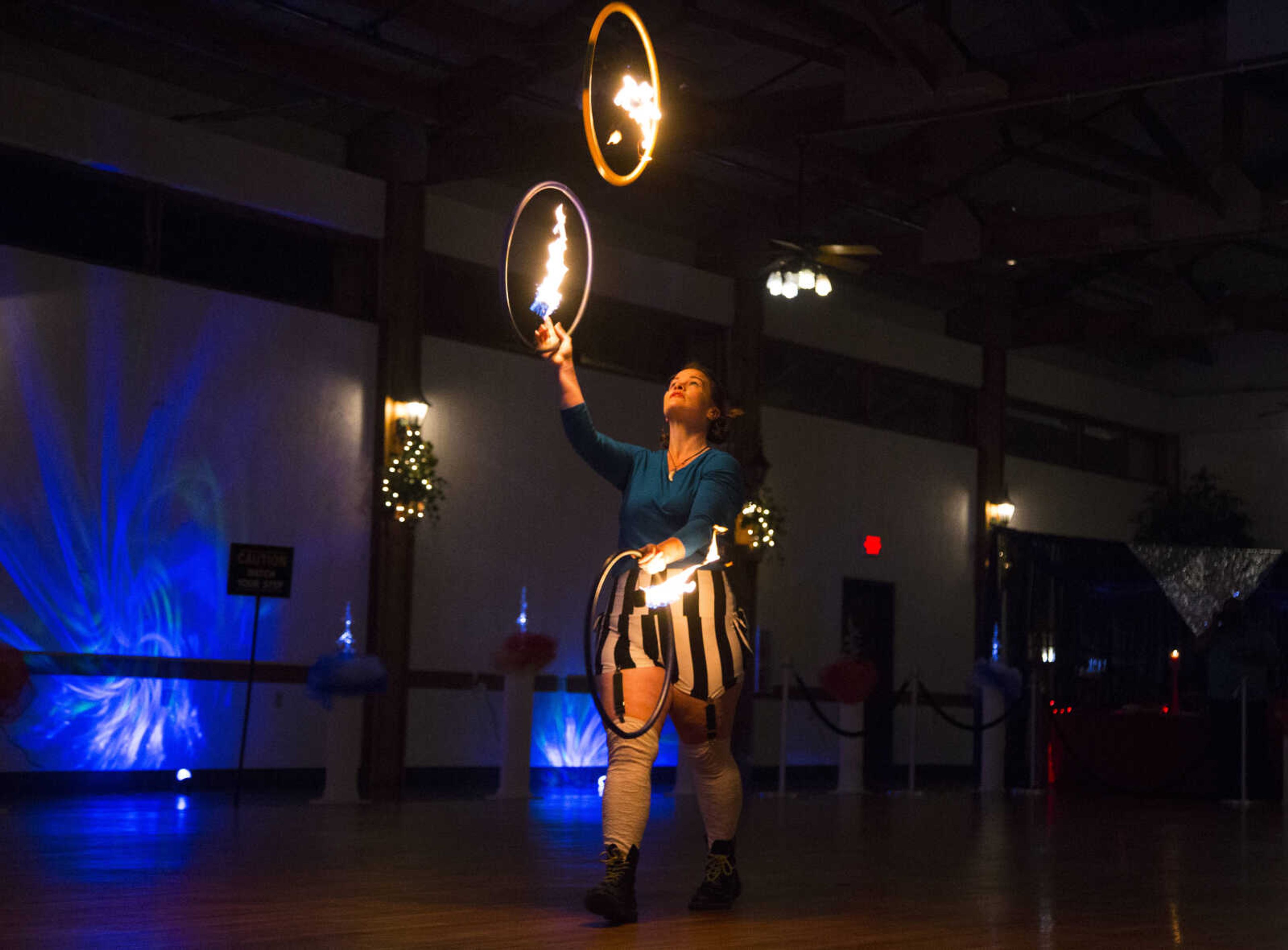 Honora Kinsella dances with fire Saturday, Feb. 3, 2018, during the Fire and Ice Gala at Bavarian Halle in Jackson.