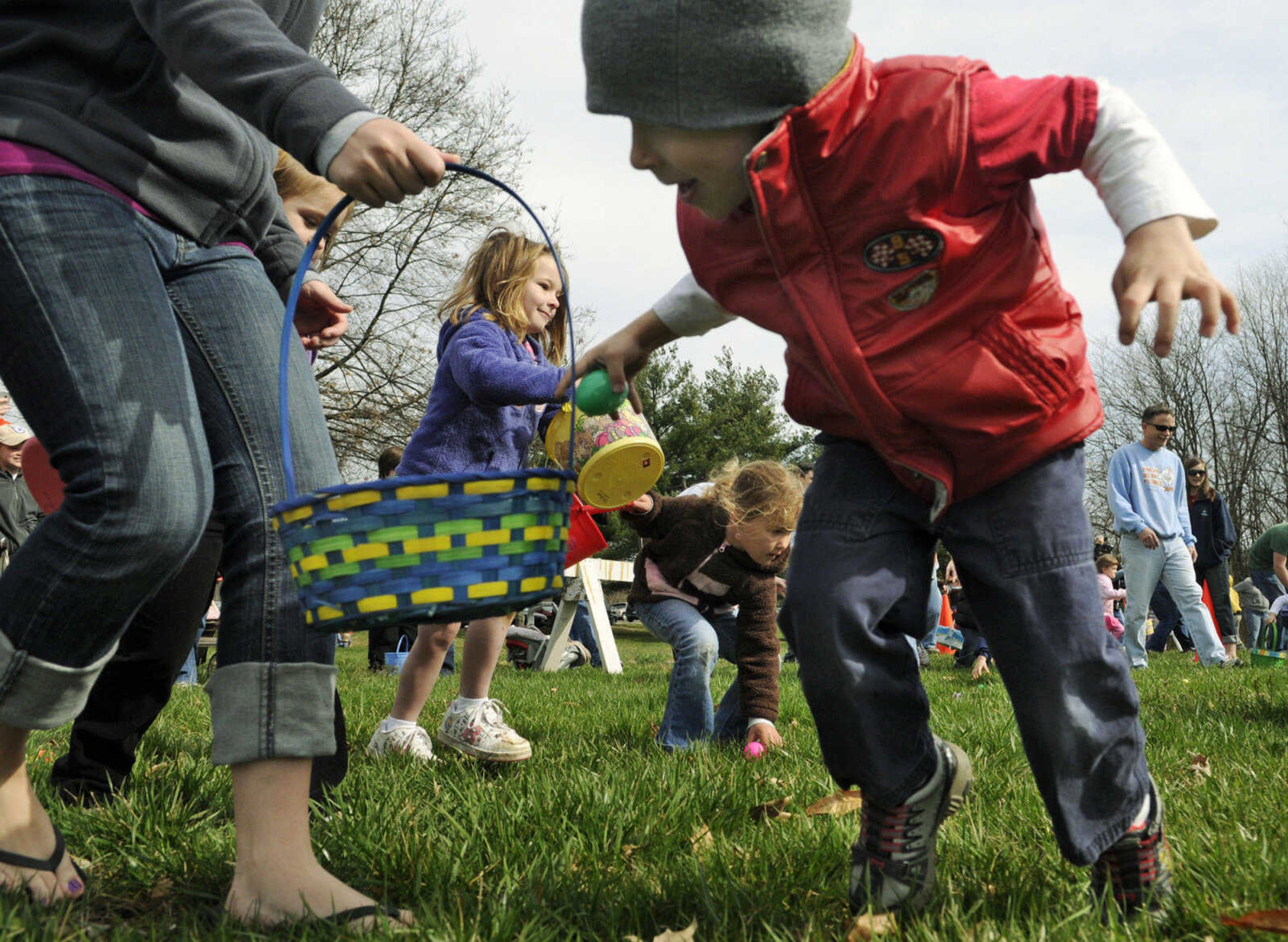 KRISTIN EBERTS ~ keberts@semissourian.com

Matthew Conklin, 4, right, tosses an egg into his basket carried by babysitter Kyndra Williams during the Cape Girardeau Parks and Recreation easter egg hunt at Kiwanis Park in Cape Girardeau, Mo., on Saturday, March 27, 2010.