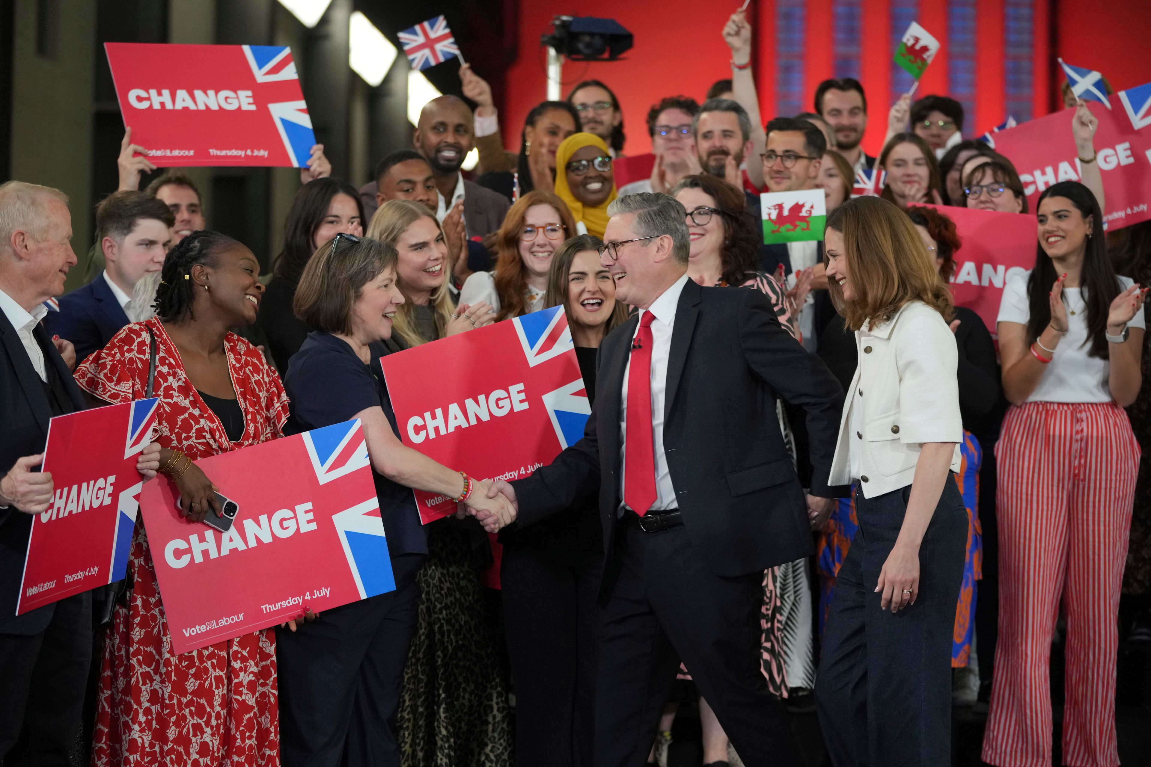 FILE - Labour Party leader Keir Starmer shakes hands with his supporters at the Tate Modern in London, Friday, July 5, 2024. (AP Photo/Kin Cheung, File)