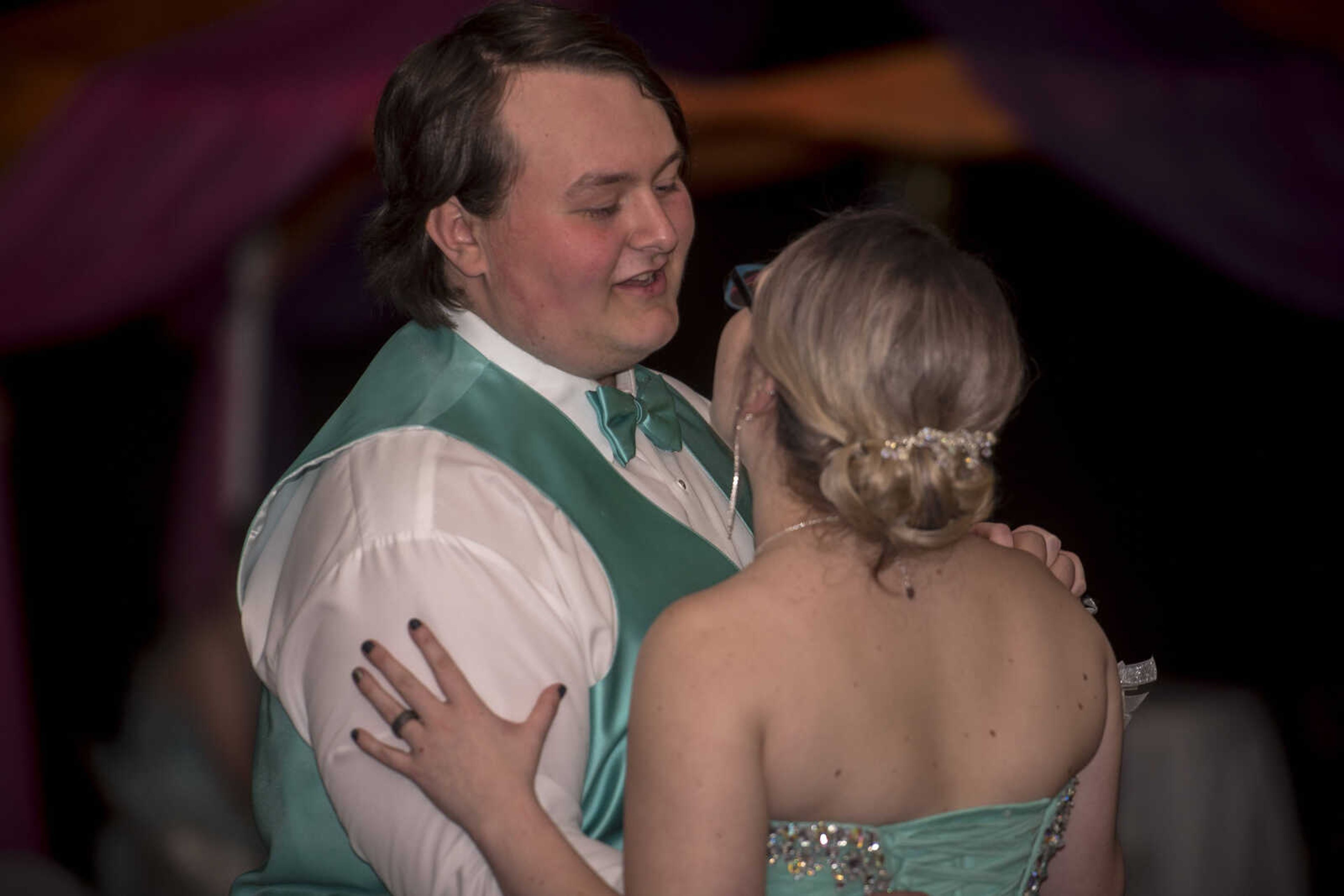 Ethan Adams and Megan Burke sing the Nitty Gritty Dirt Band's "Fishin' in the Dark" to one another while dancing together as prom came to a close Saturday, April 6, 2019, at Kelly High School in Benton.