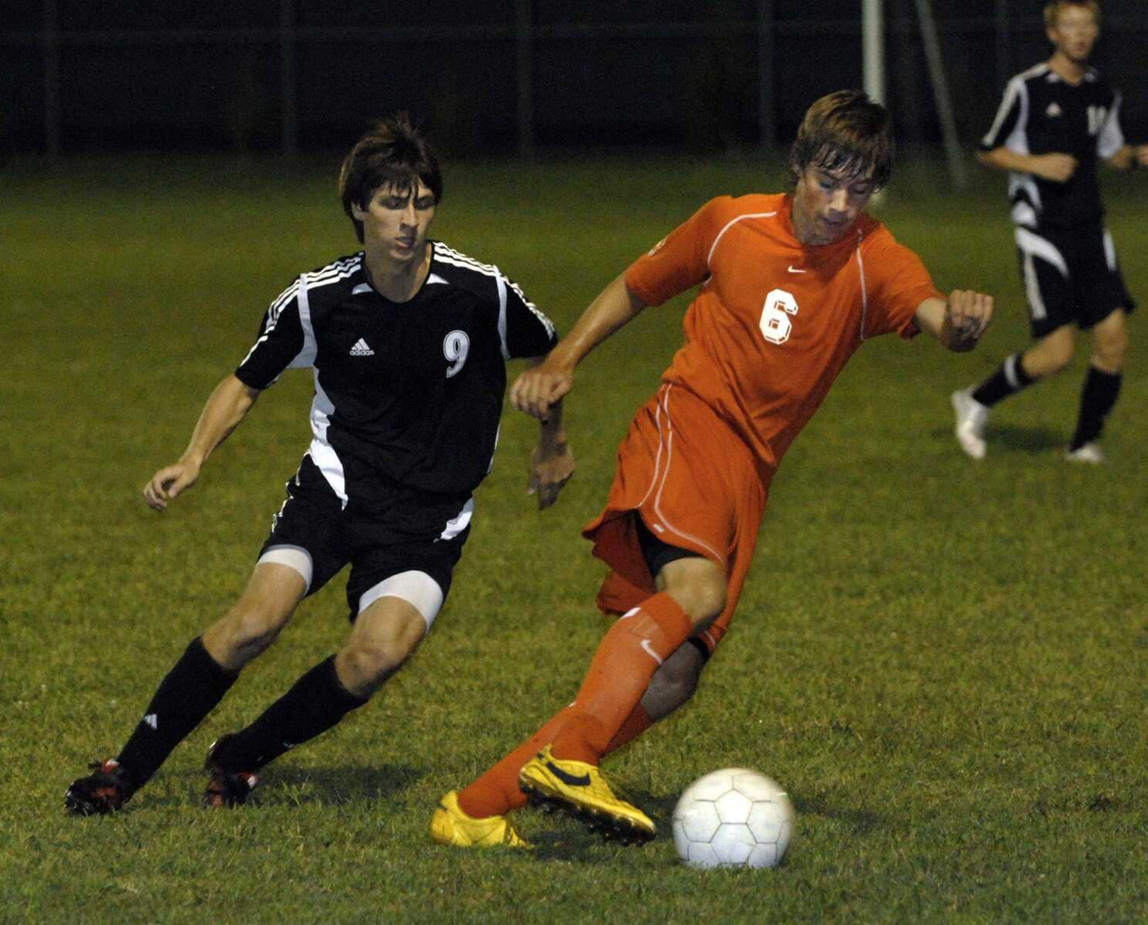 Central's Spencer Lovig dribbles away from Jackson's Jacob Scholl during the first half Tuesday at Central. (Fred Lynch)