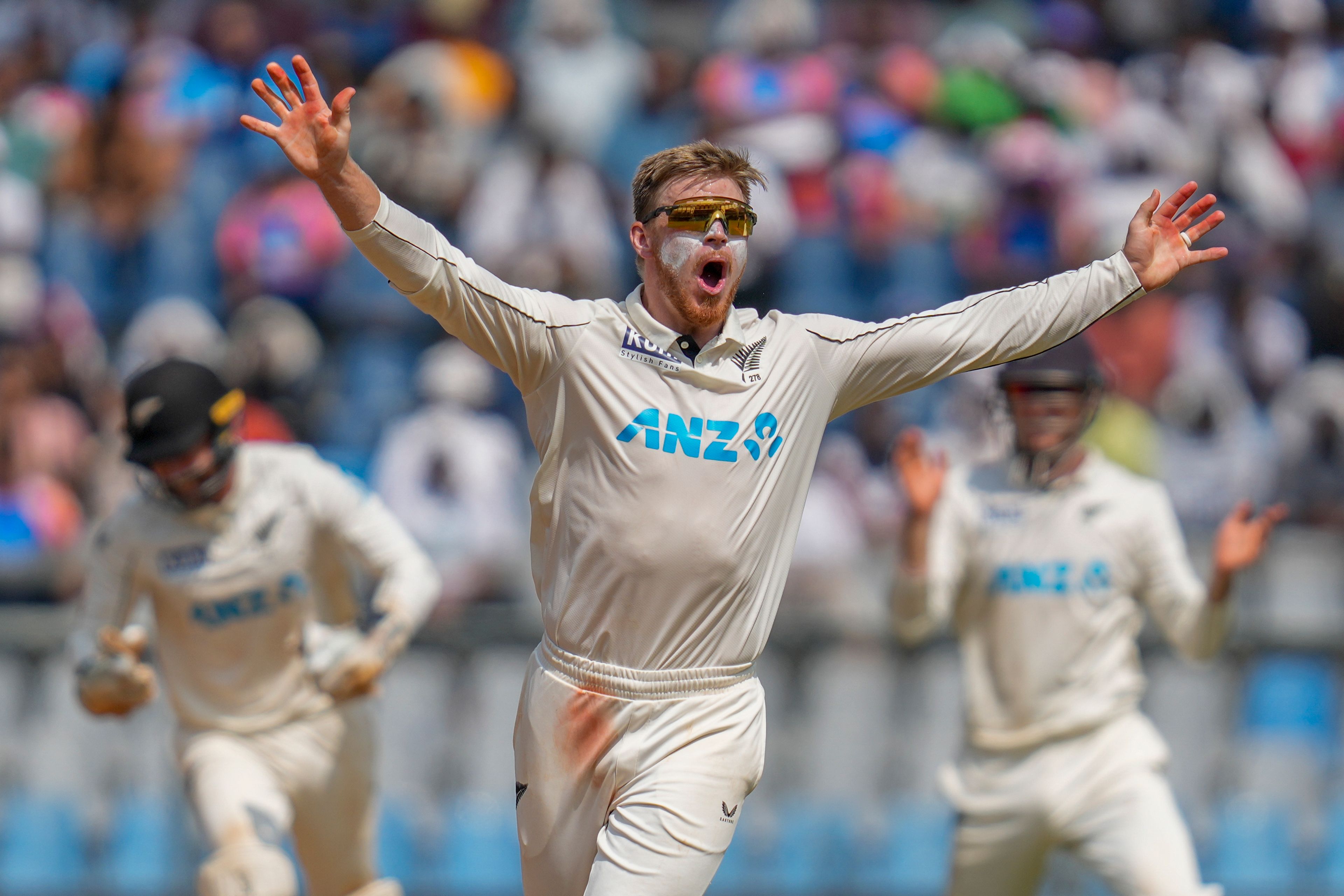 New Zealand's Glenn Phillips celebrates the dismissal of India's Ravichandran Ashwin during the third day of the third cricket test match between India and New Zealand at Wankhede Stadium, in Mumbai, India, Sunday, Nov. 3, 2024.(AP Photo/Rajanish Kakade)