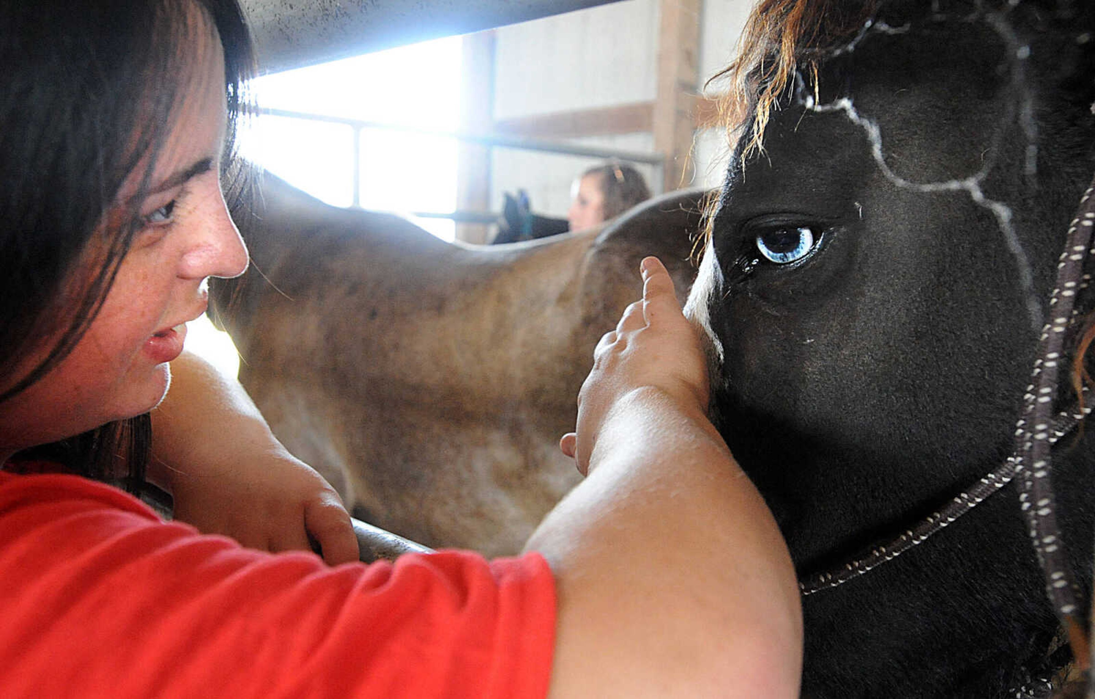 LAURA SIMON ~ lsimon@semissourian.com

Elizabeth Sauceda visits with Dutchess, and American curly horse during the 12th annual Agriculture Education Field Day hosted by Southeast missouri State University's Department of Agriculture. Around 400 students from area schools spent the day learning at the Charles Hutson Horticulture Greenhouse and the David M. Barton Research Center.