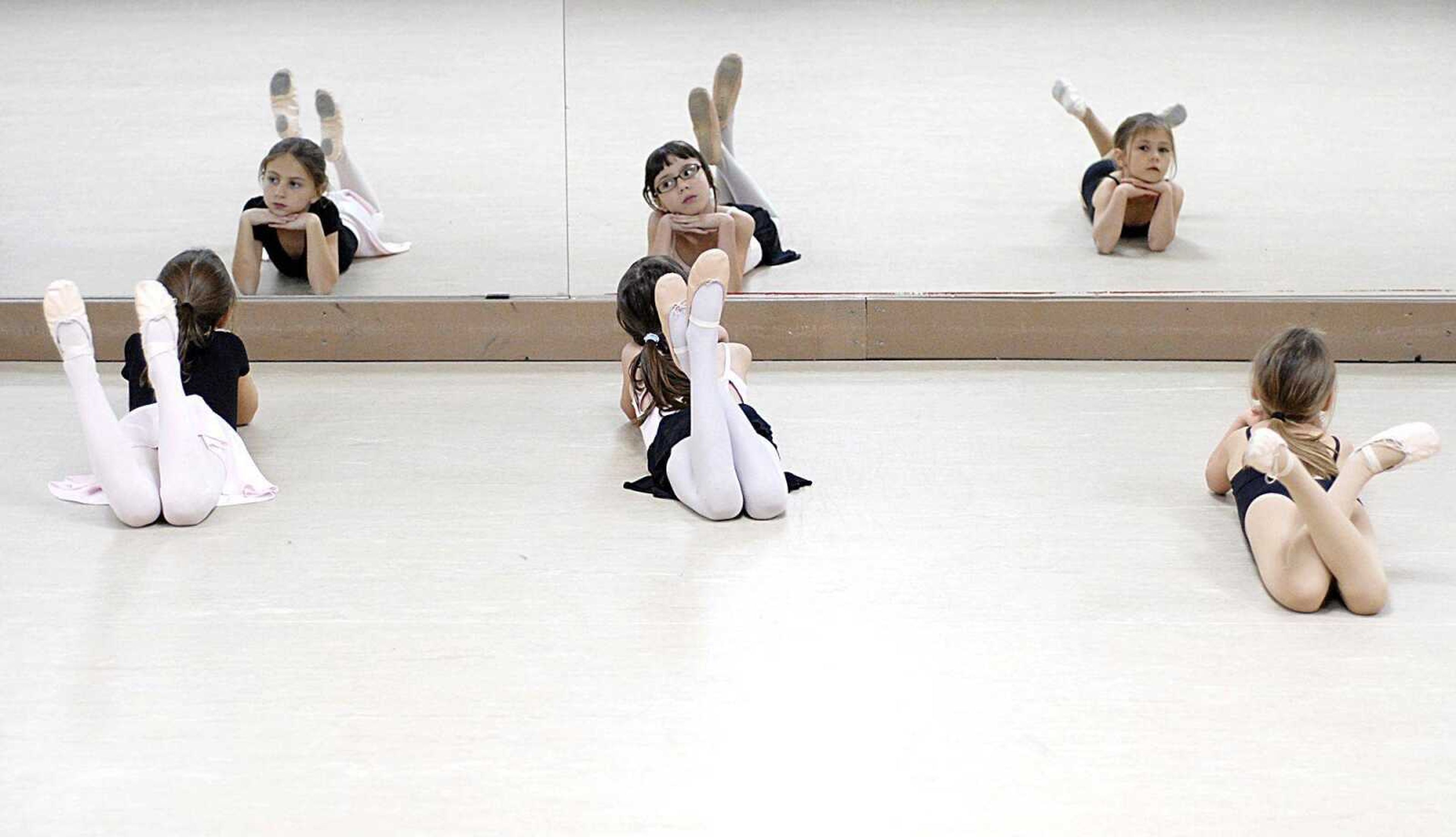 @SL_cutline_body:Taylor Smith, Jasmine Jones, and Larissa Bell practiced their parts as snowflakes in the Moscow Ballet's production of "The Great Russian Nutcracker." Sixty-one local children will perform the ballet with professionals.. (Aaron Eisenhauer)