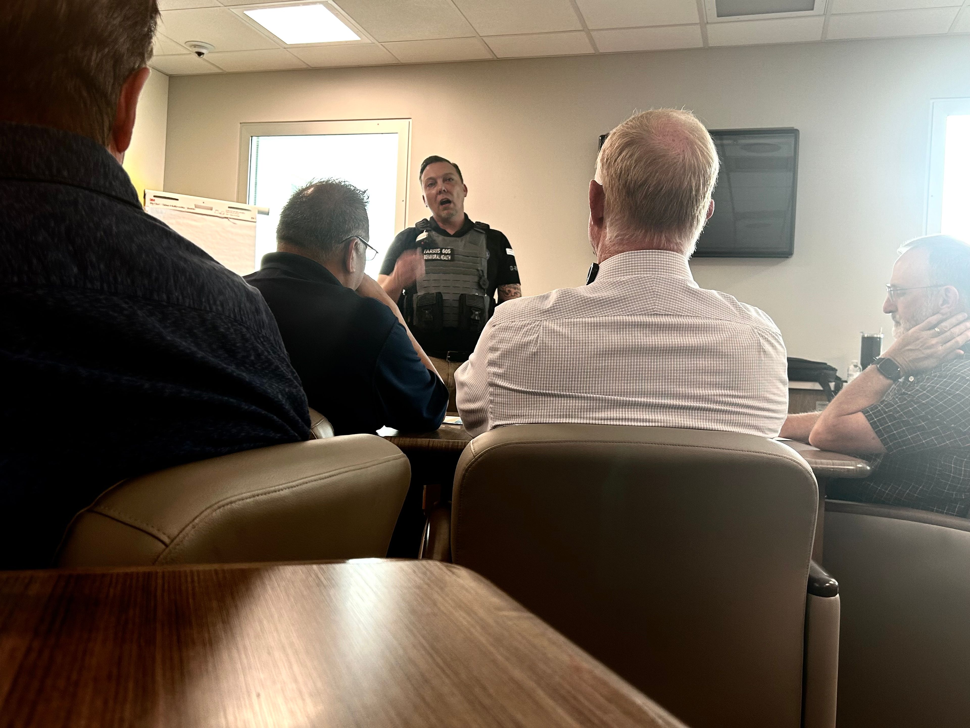 Cape Girardeau Police Department co-responder Shannon Farris speaks to a group of area pastors, faith-based leaders and social workers at a meeting on Wednesday, Sept. 18, 2024.