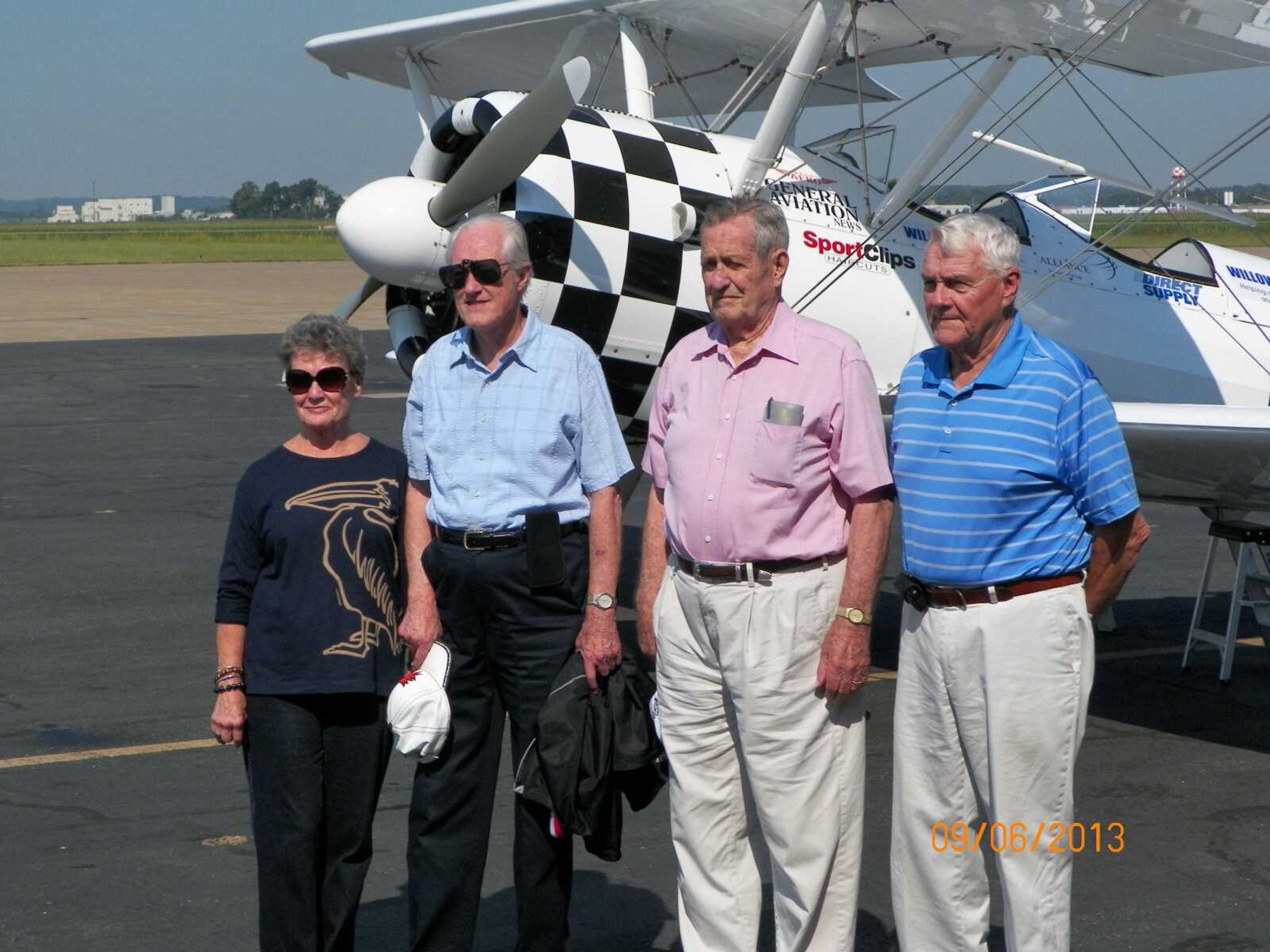 Chateau Girardeau residents Kathryn Vance, John Shelton, Emra "Pug" Kurre, and Gene Beussink pose with the Stearman before taking flight.