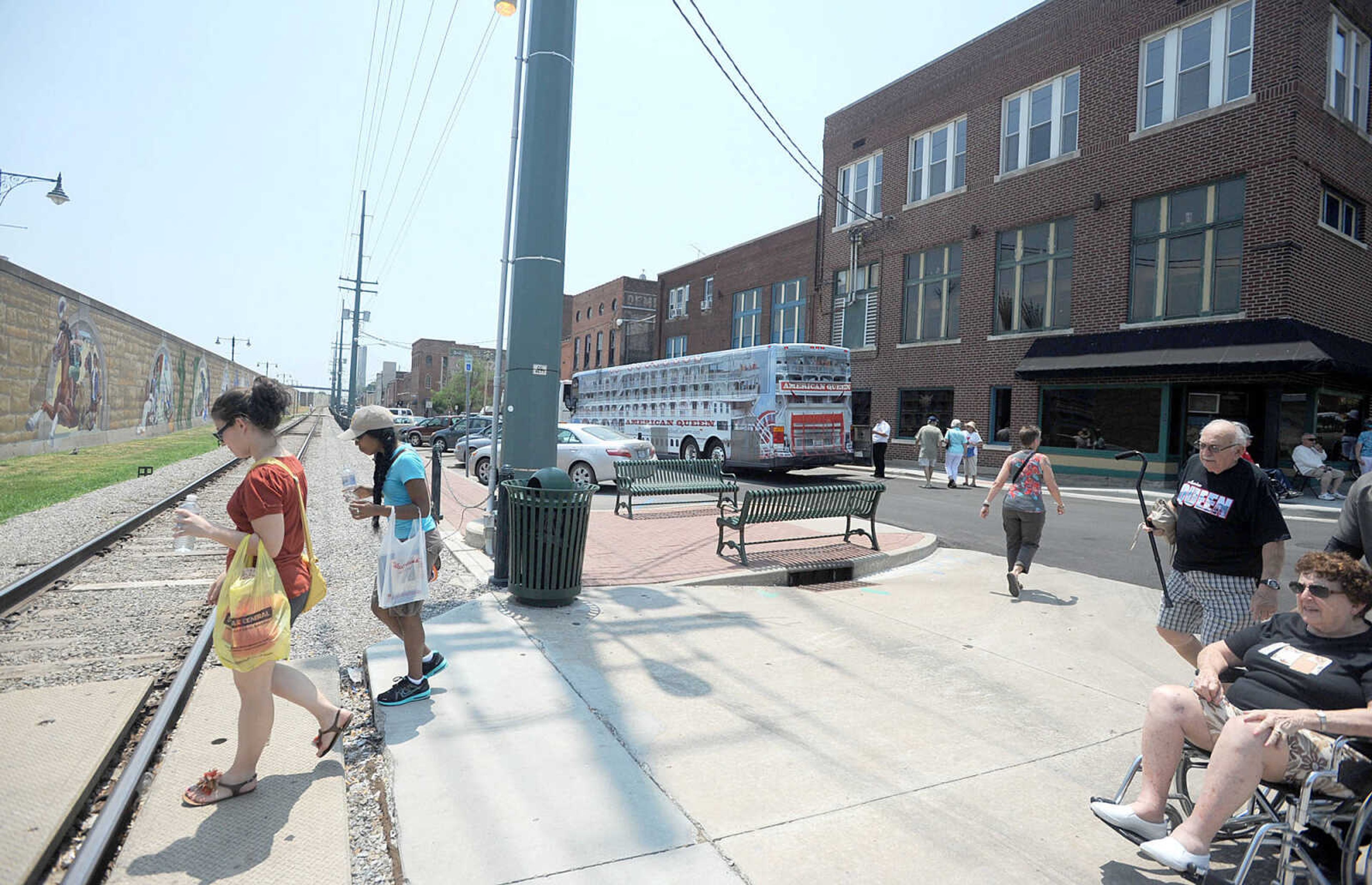 LAURA SIMON ~ lsimon@semissourian.com
Passengers and visitors head towards the Mississippi River to board and get a glimpse of the the American Queen steamboat Monday, July 2, 2012 as it is docked in downtown Cape Girardeau. The steamboat is traveling from Memphis, Tenn. to St. Louis, Mo.