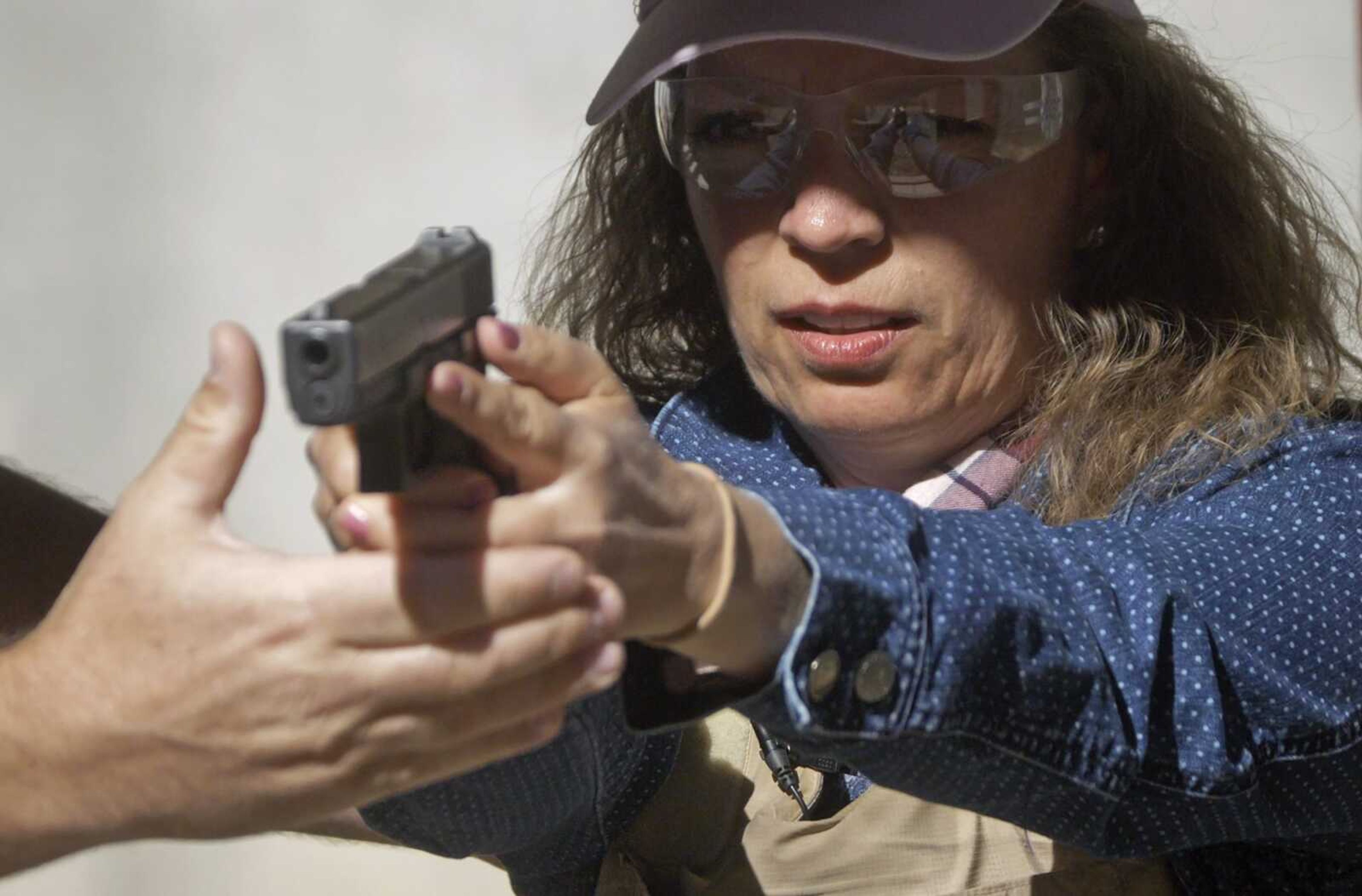 Cindy Bullock, Timpanogos Academy (Utah) secretary, participates in recent shooting drills at the Utah County Sheriff's Office shooting range during the teacher's academy training in Spanish Fork Canyon, Utah.