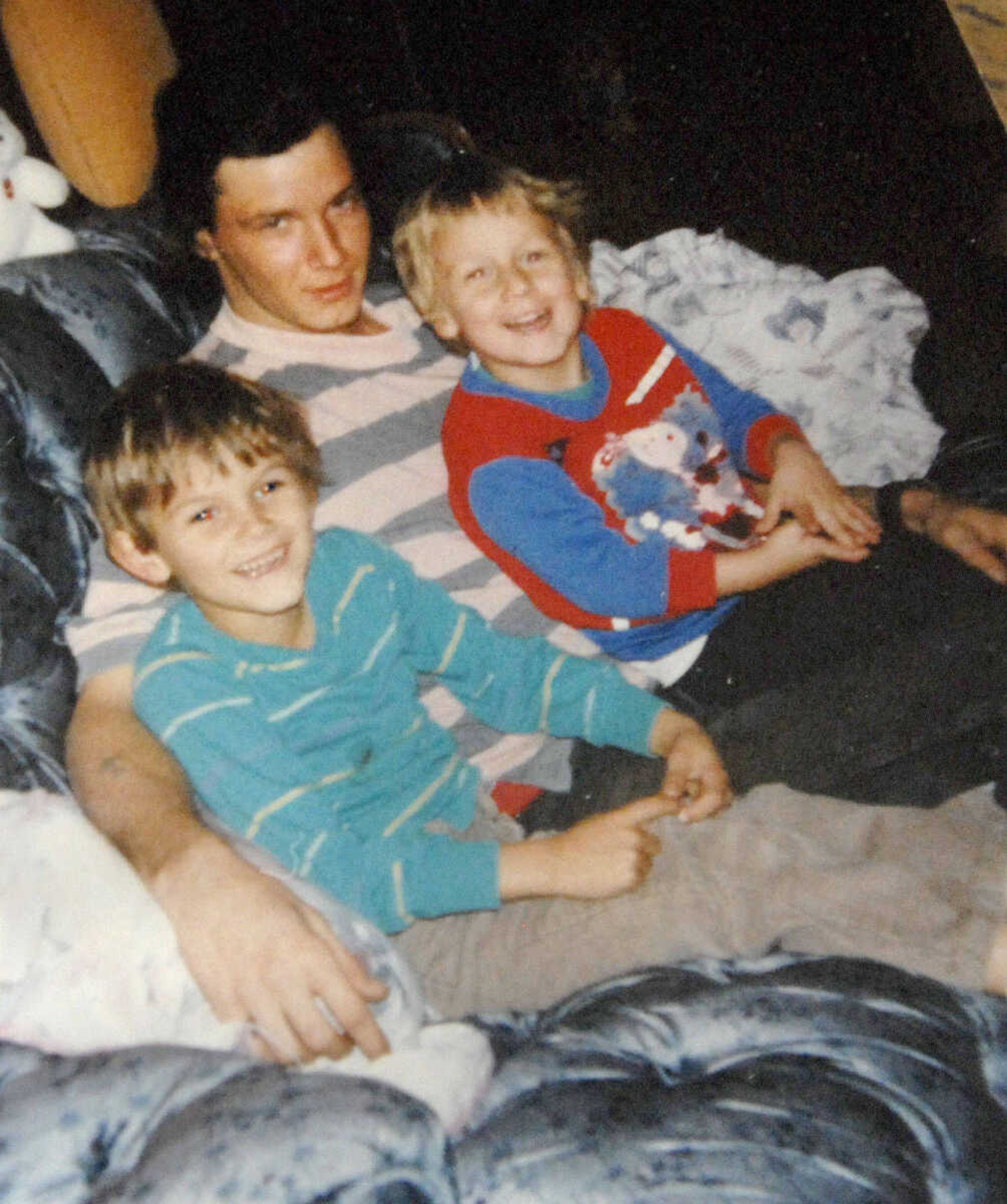 Michael Sanders sits with his sons John Michael, left, and Zach. (Submitted photo)