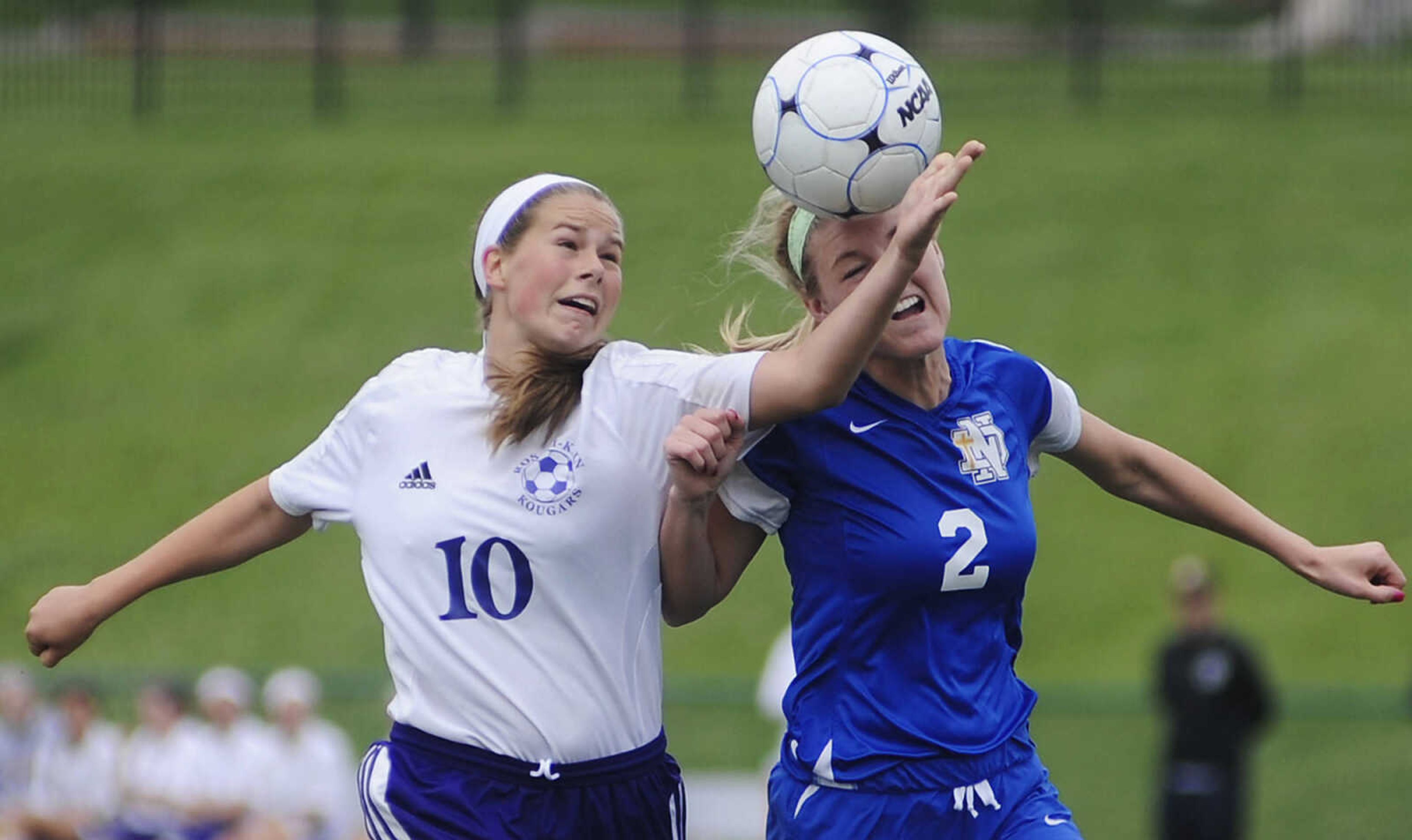 ADAM VOGLER ~ avogler@semissourian.com
Notre Dame's Taylor Rinda heads the ball past Rosati-Kain's Brooke Greiner during the Bulldogs' 2-0 loss to the Cougars in the Class 2 girls soccer quarterfinal Saturday, May 25, at St. Louis University High School in St. Louis, Mo. This is the second consecutive year that Rosati-Kain has defeated Notre Dame in the quarterfinal game.