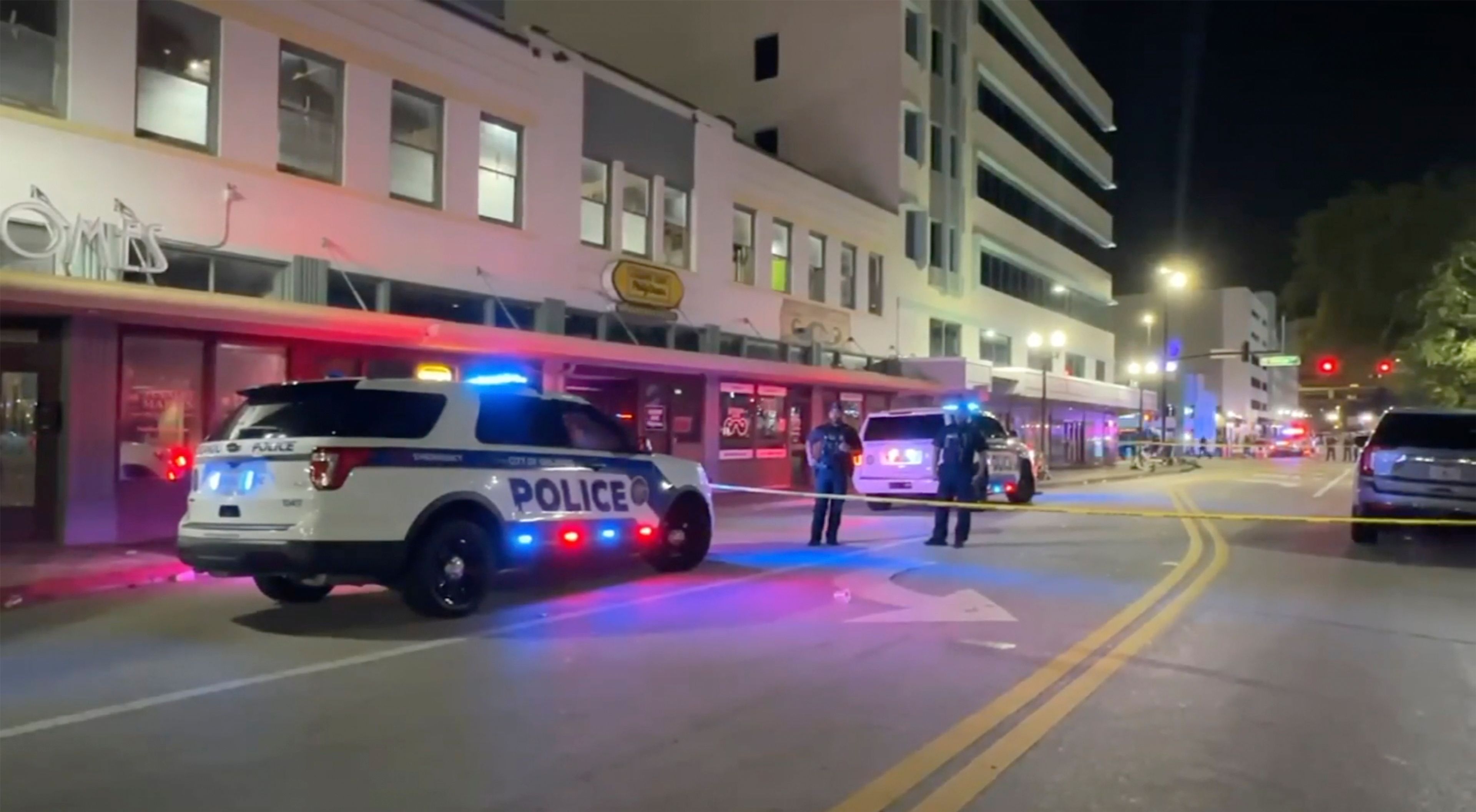 Police investigate the scene of two shootings that took place among crowds during Halloween celebrations early Friday, Nov. 1. 2024 in Orlando, Fla. (WFTV via AP)