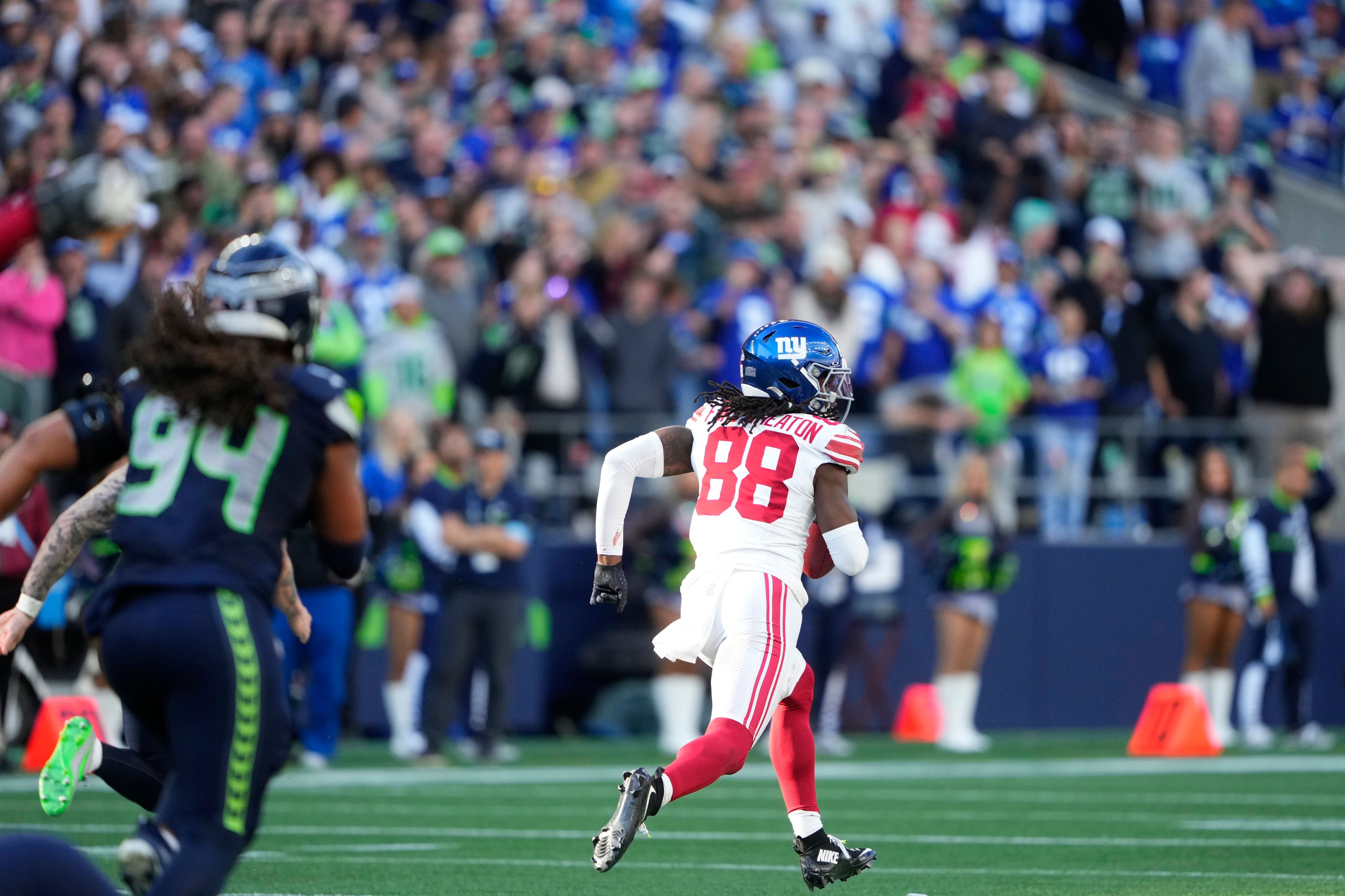 New York Giants wide receiver Bryce Ford-Wheaton (88) runs for a touchdown after a Seattle Seahawks blocked field goal attempt during the second half of an NFL football game, Sunday, Oct. 6, 2024, in Seattle. (AP Photo/Lindsey Wasson)