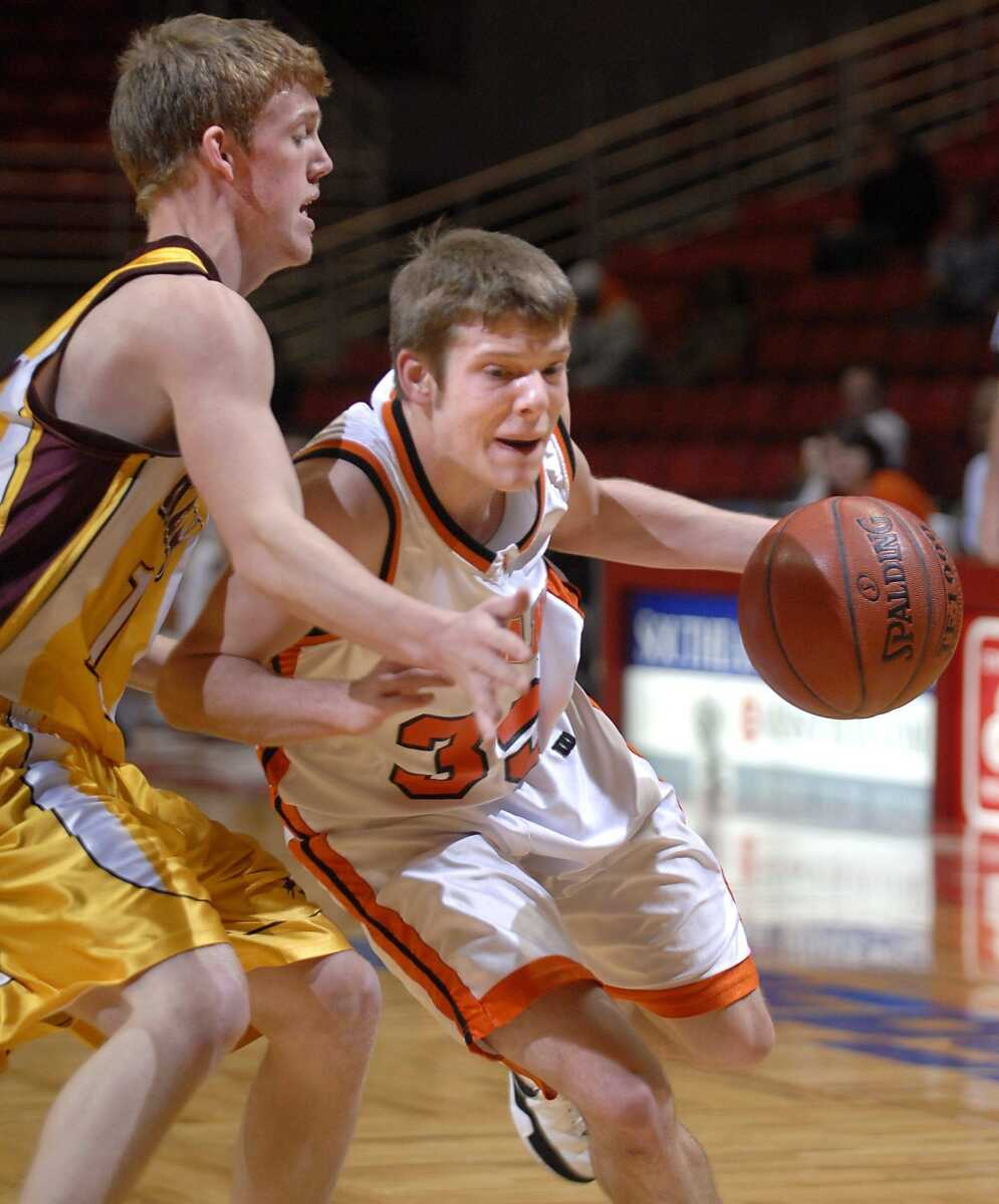 Advance's Jacob Bond drove around Kelly's Chris Cooper in the first quarter Saturday at the Southeast Missourian Christmas Tournament. (Kit Doyle)