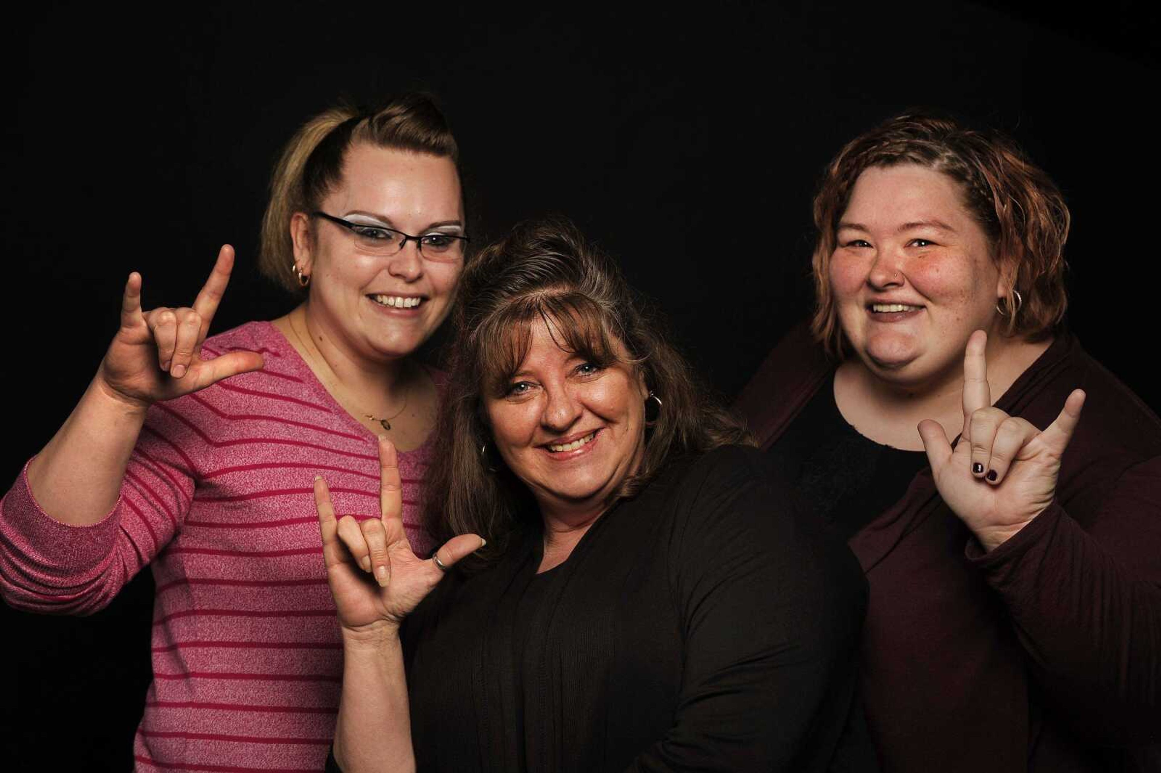 Hope Franklin, Jackie Cole and Johnna Cutrell work together at the Southeast Alliance for Disability Independence in Cape Girardeau.