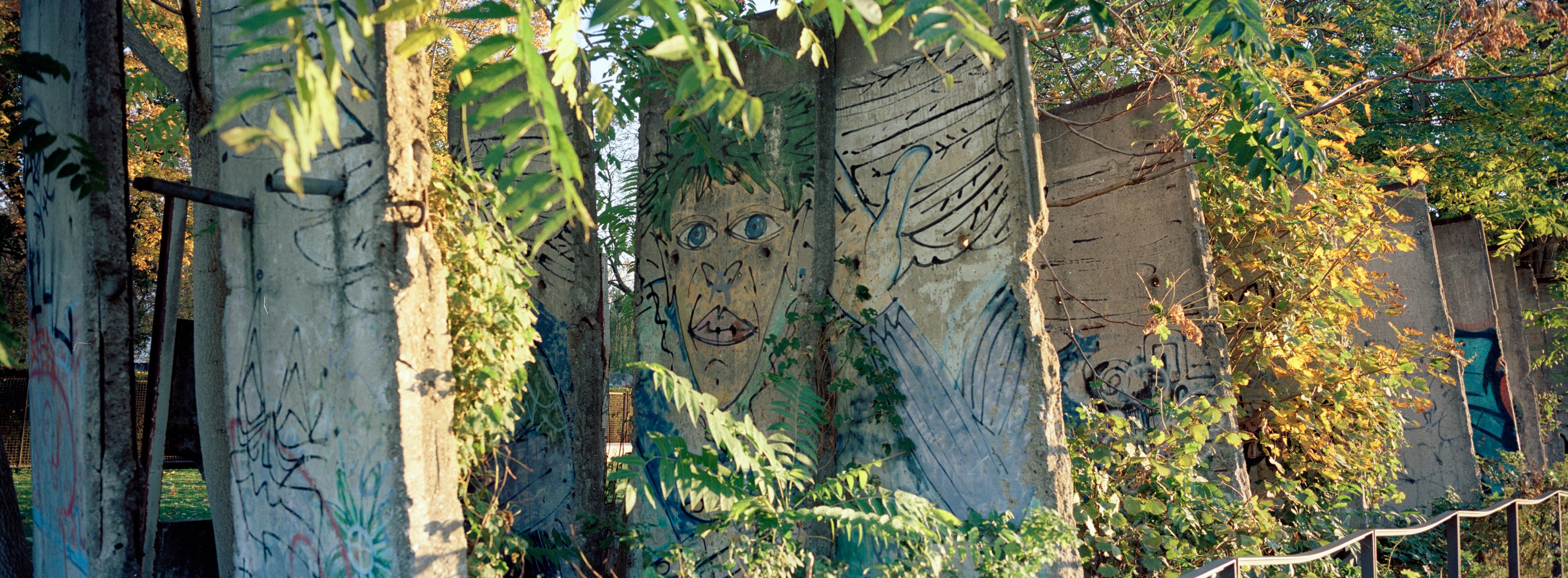 The evening sun shines on remains of the Berlin Wall at the official Berlin Wall memorial site at Bernauer Strasse, in Berlin, Germany, Wednesday, Oct. 23, 2024. (AP Photo/Markus Schreiber)