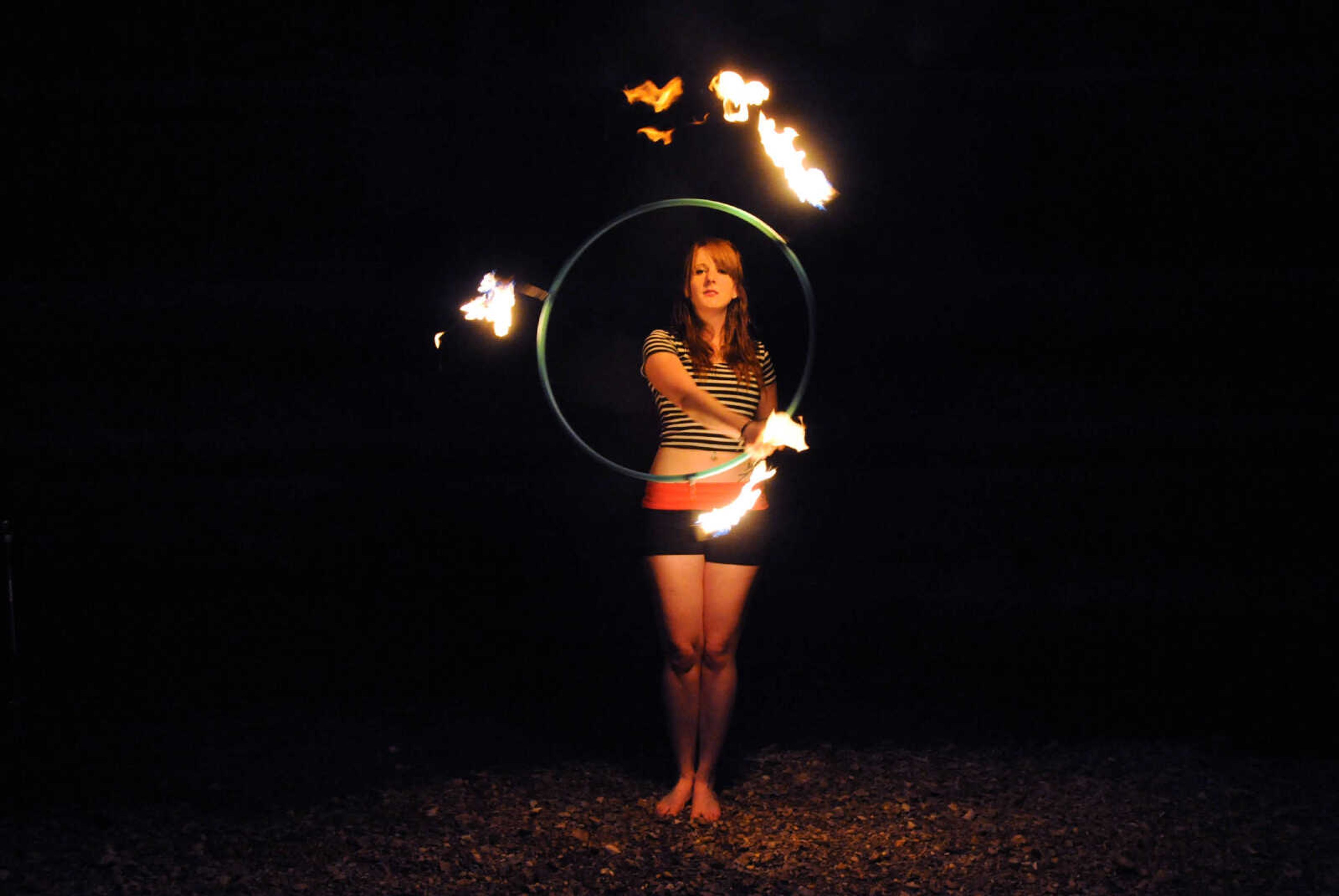 LAURA SIMON ~ lsimon@semissourian.com

Chelsie Welker fire hoops in a Cape Girardeau County creek, Tuesday, May 26, 2015.