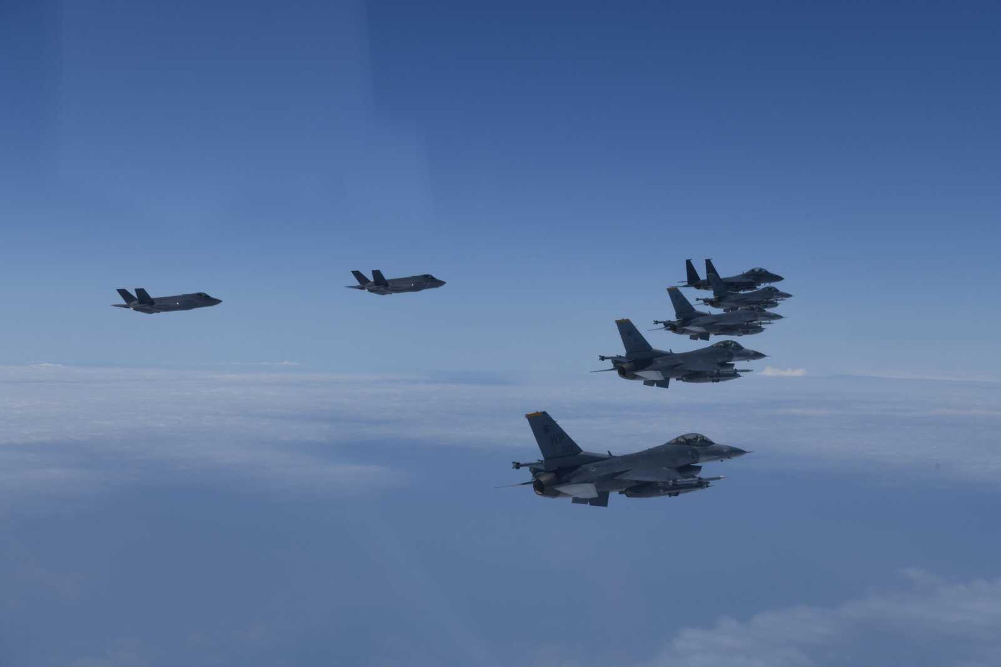 U.S. and South Korea Air Force fighter jets fly in formation during a joint drill Tuesday. The South Korean and U.S. militaries flew 20 fighter jets over South Korea's western sea Tuesday in a continued show of force as a senior U.S. official warned of a forceful response if North Korea goes ahead with its first nuclear test explosion in nearly five years.